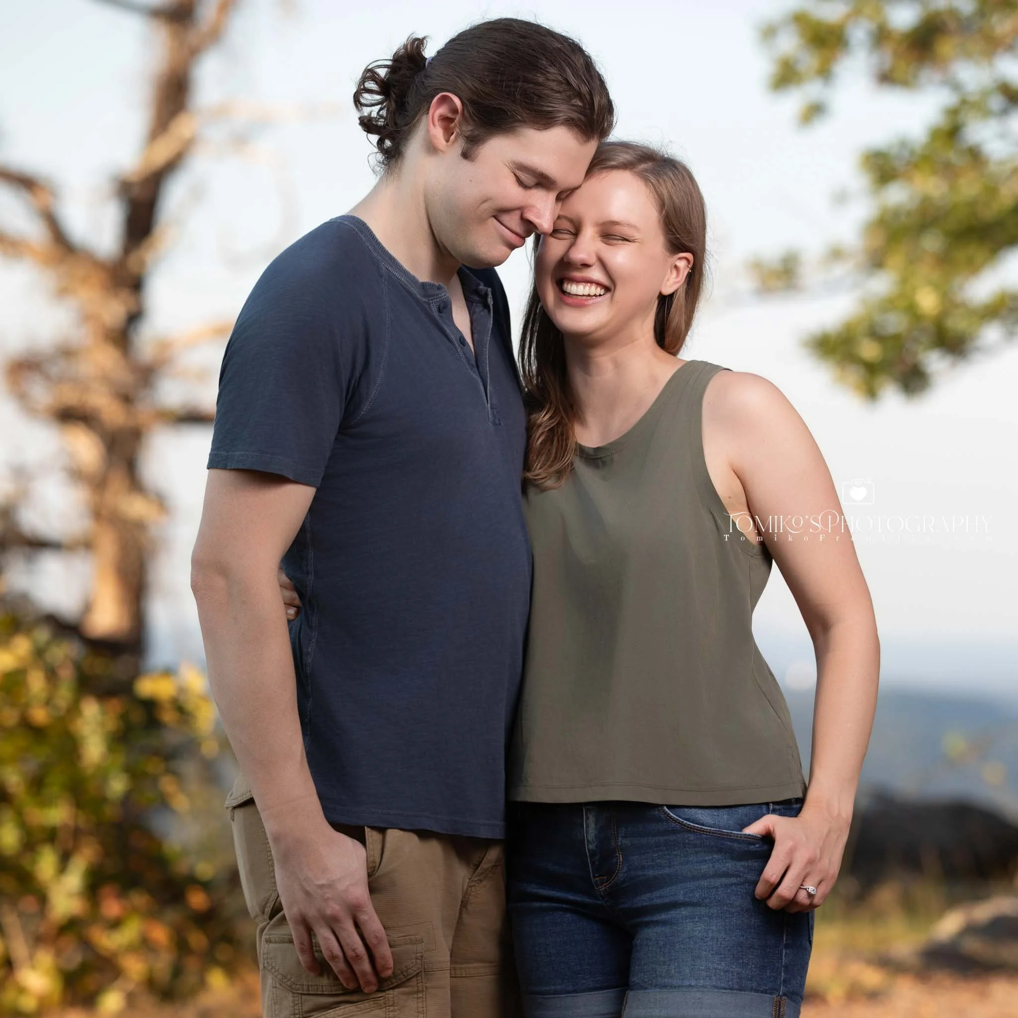 Romantic engagement moment as she says yes at Oak Mountain State Park, photographed with soft natural light.