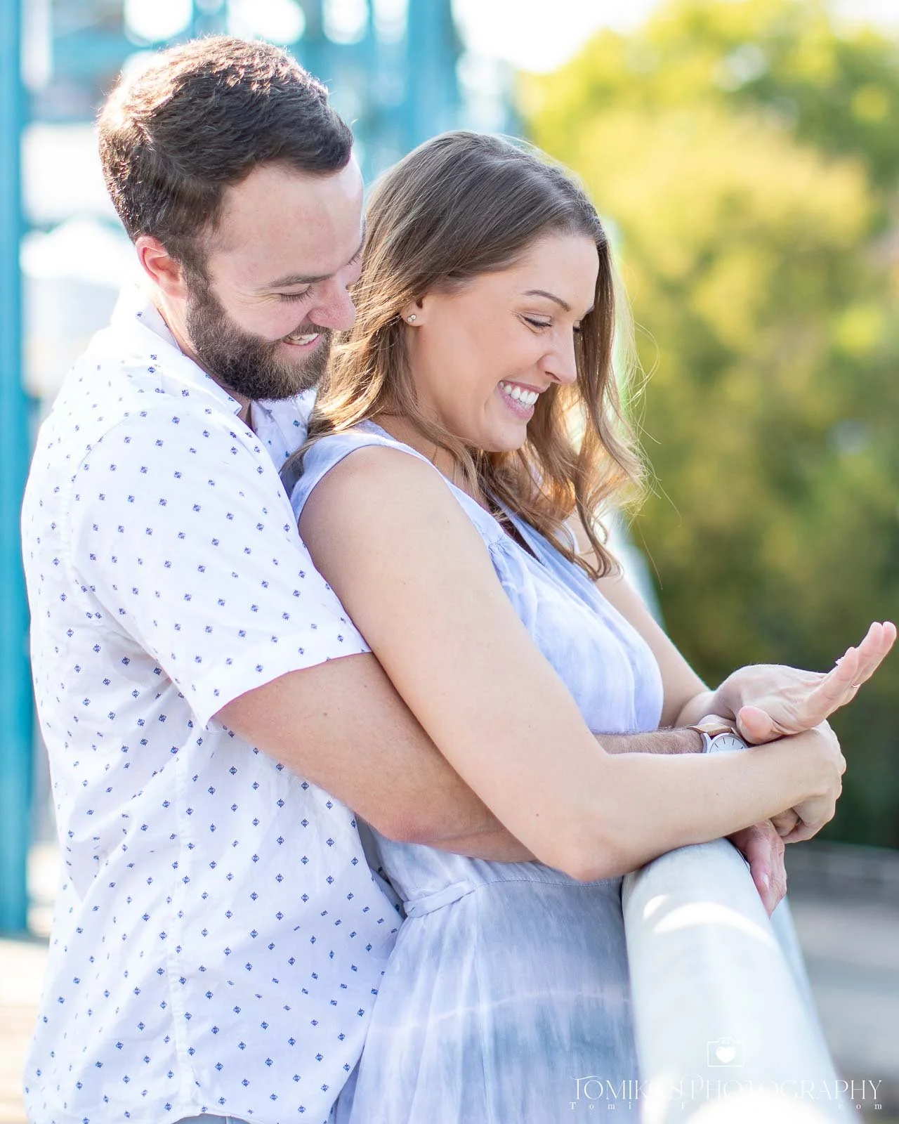 Surprise Engagement Photography - Candid Moment of Woman Looking At Engagement Ring