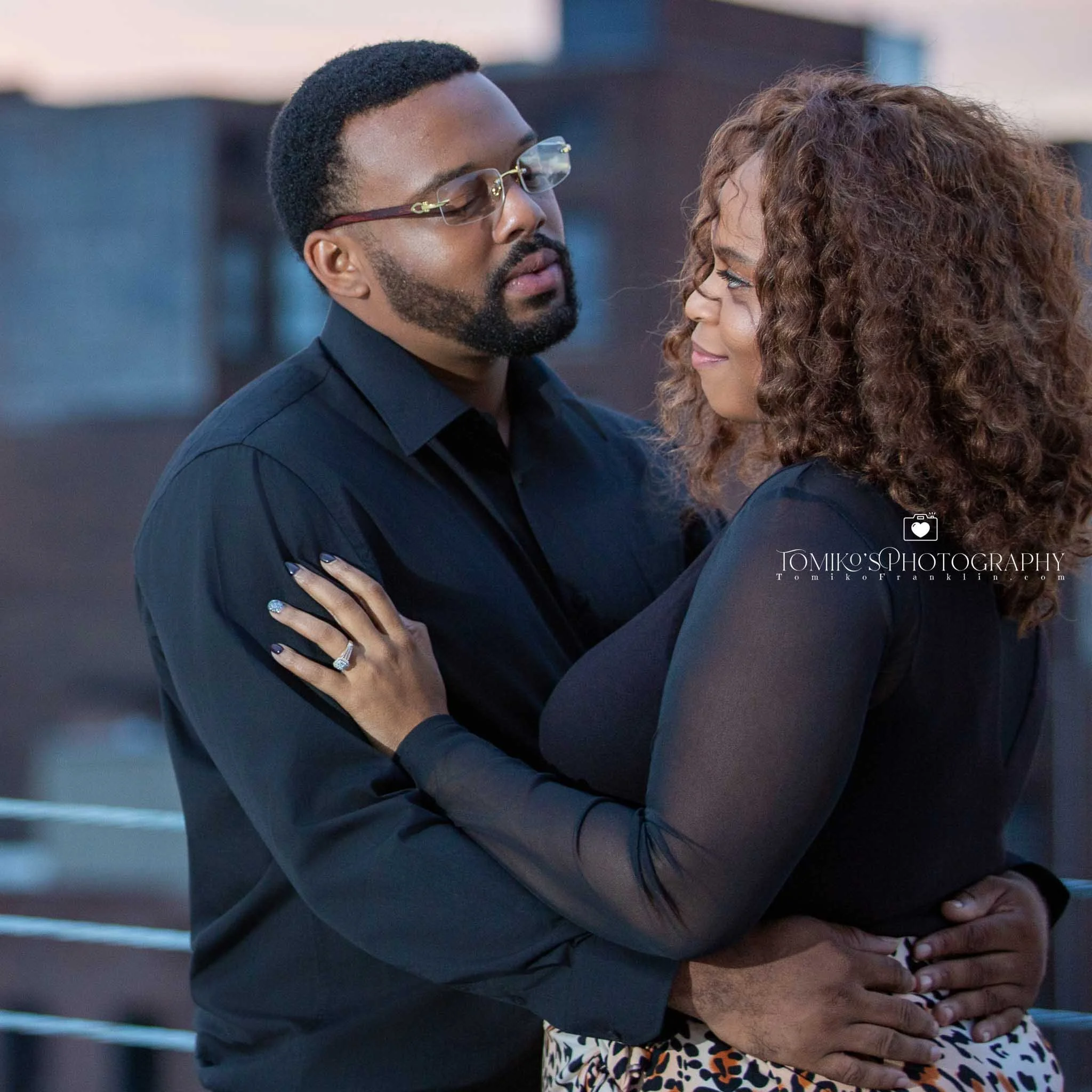 Birmingham engagement photographer capturing a couple walking hand‑in‑hand through Railroad Park at sunset.