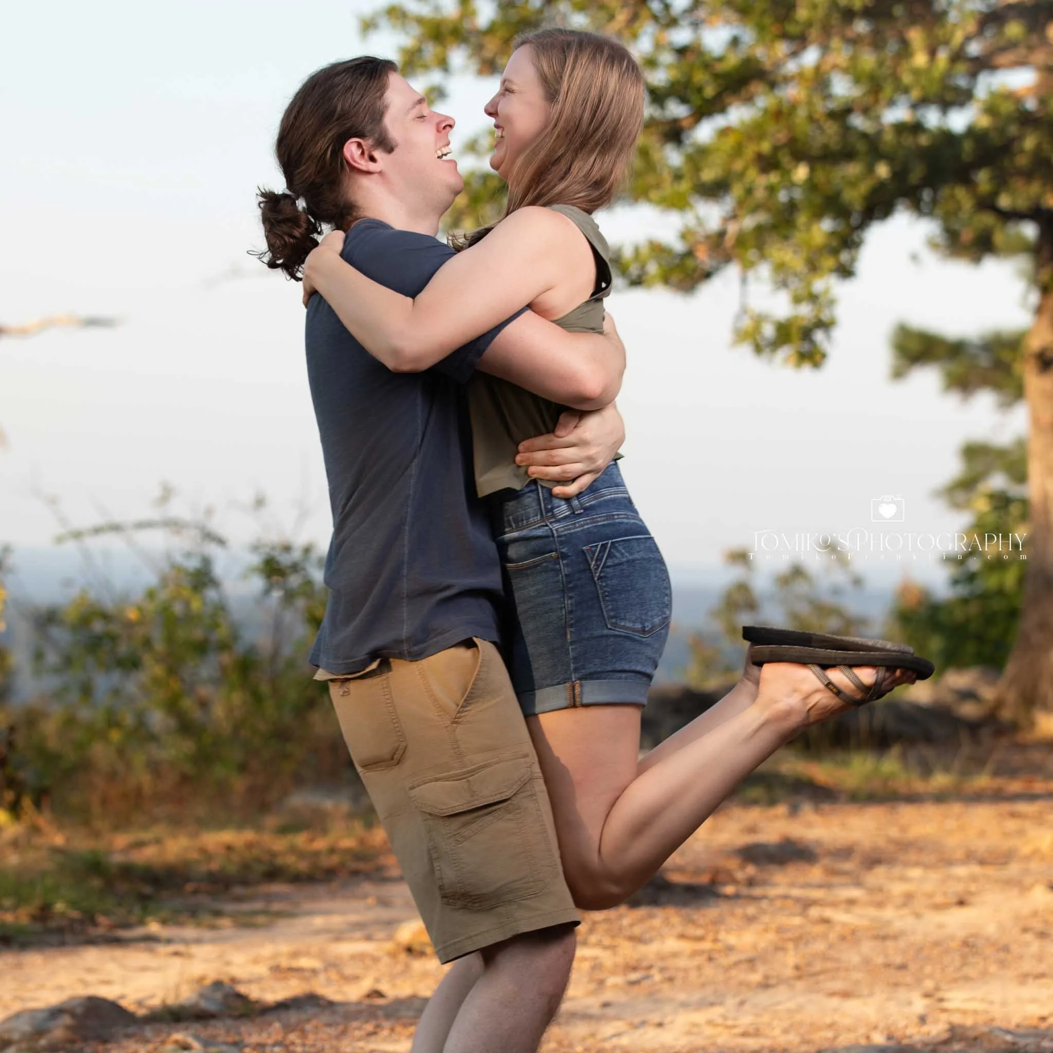 Joyful reaction during a surprise engagement proposal at Oak Mountain’s scenic overlook.