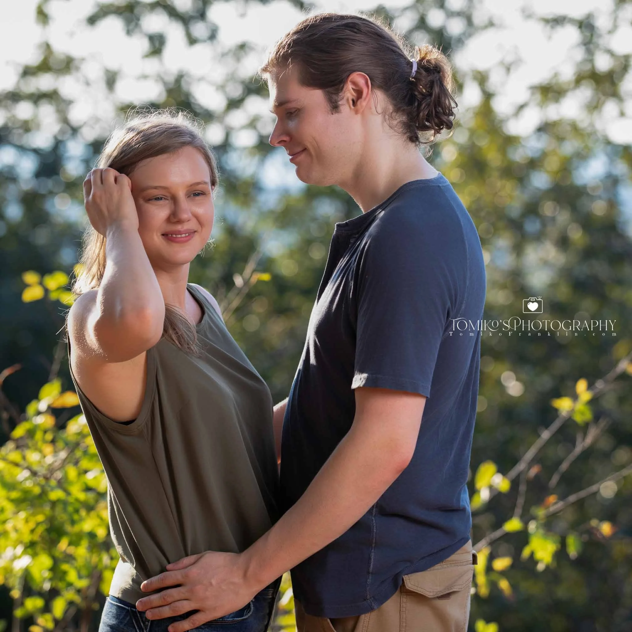 Surprise proposal captured at Oak Mountain’s lake pier with elegant, timeless engagement photography.