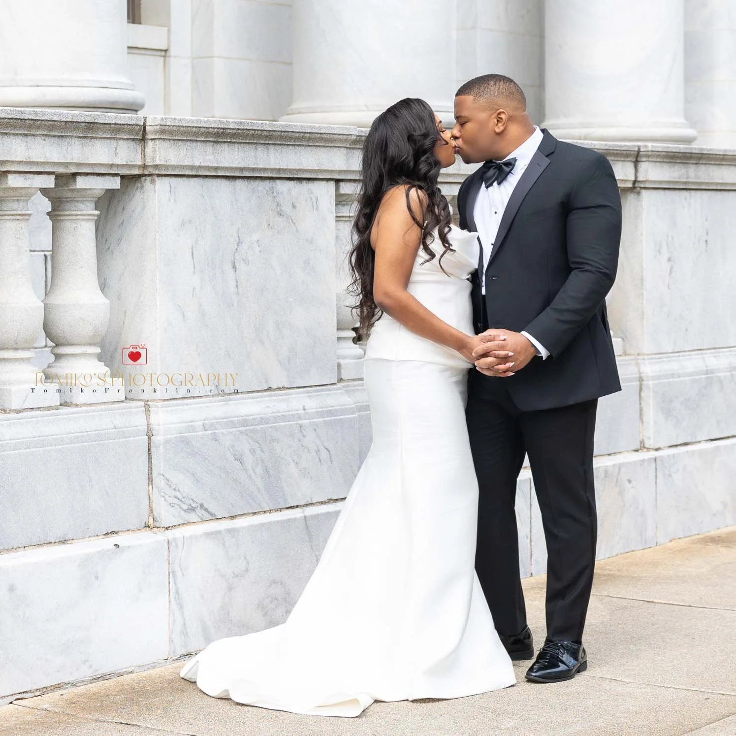 Elopement photo of a Birmingham couple posing in front of the courthouse after their intimate ceremony. Elegant, documentary‑style elopement photography captured by a Birmingham AL elopement photographer specializing in courthouse weddings, micro wed