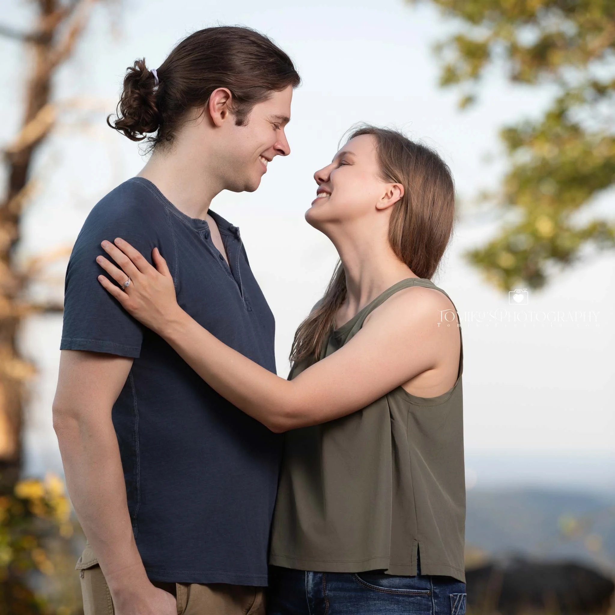 Discreetly captured surprise proposal at Oak Mountain’s wooded trail with emotional storytelling imagery.