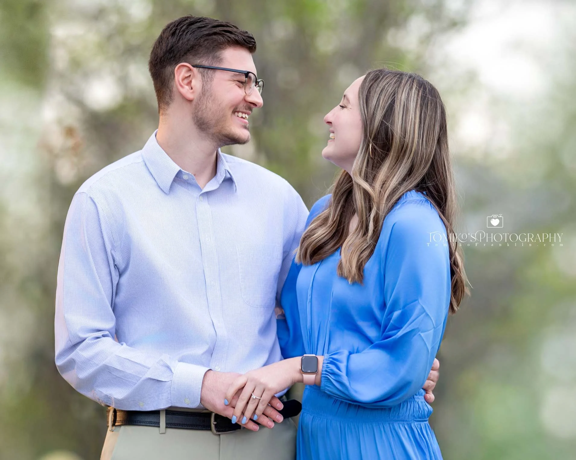 Nearly engaged couple holding hands and gazing into each other’s eyes during a romantic proposal photography session in Birmingham, AL, captured in a soft, elegant, modern style.