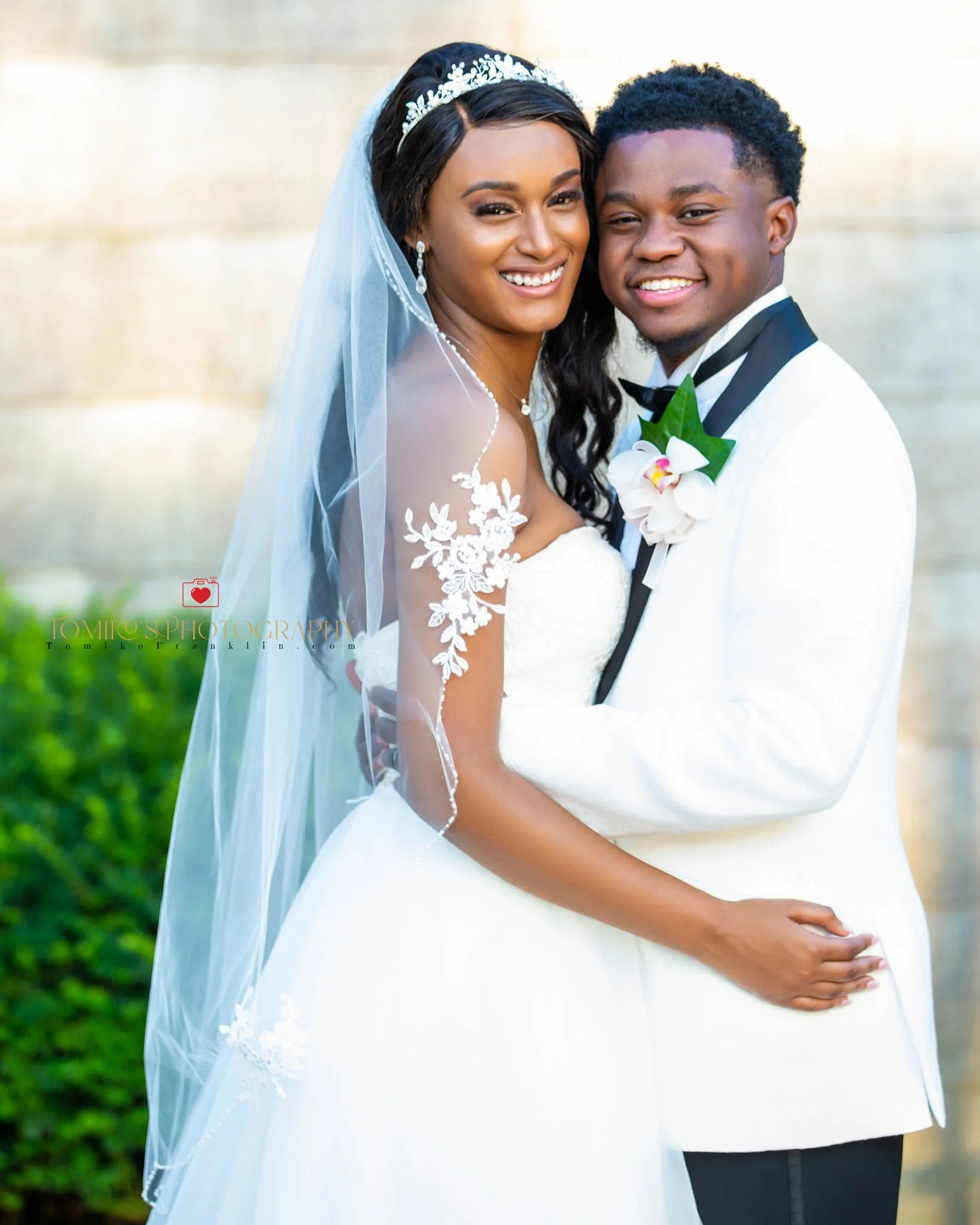 Bride and groom embracing during sunset portraits at a Birmingham wedding venue.