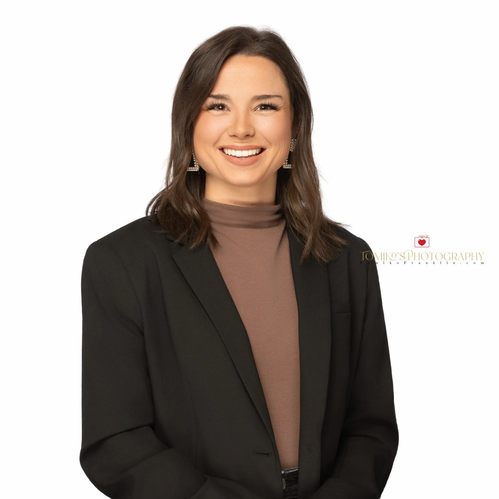 Studio headshot of a woman taken in Birmingham, Alabama, featuring a professional pose and attire suitable for business profiles or corporate branding.