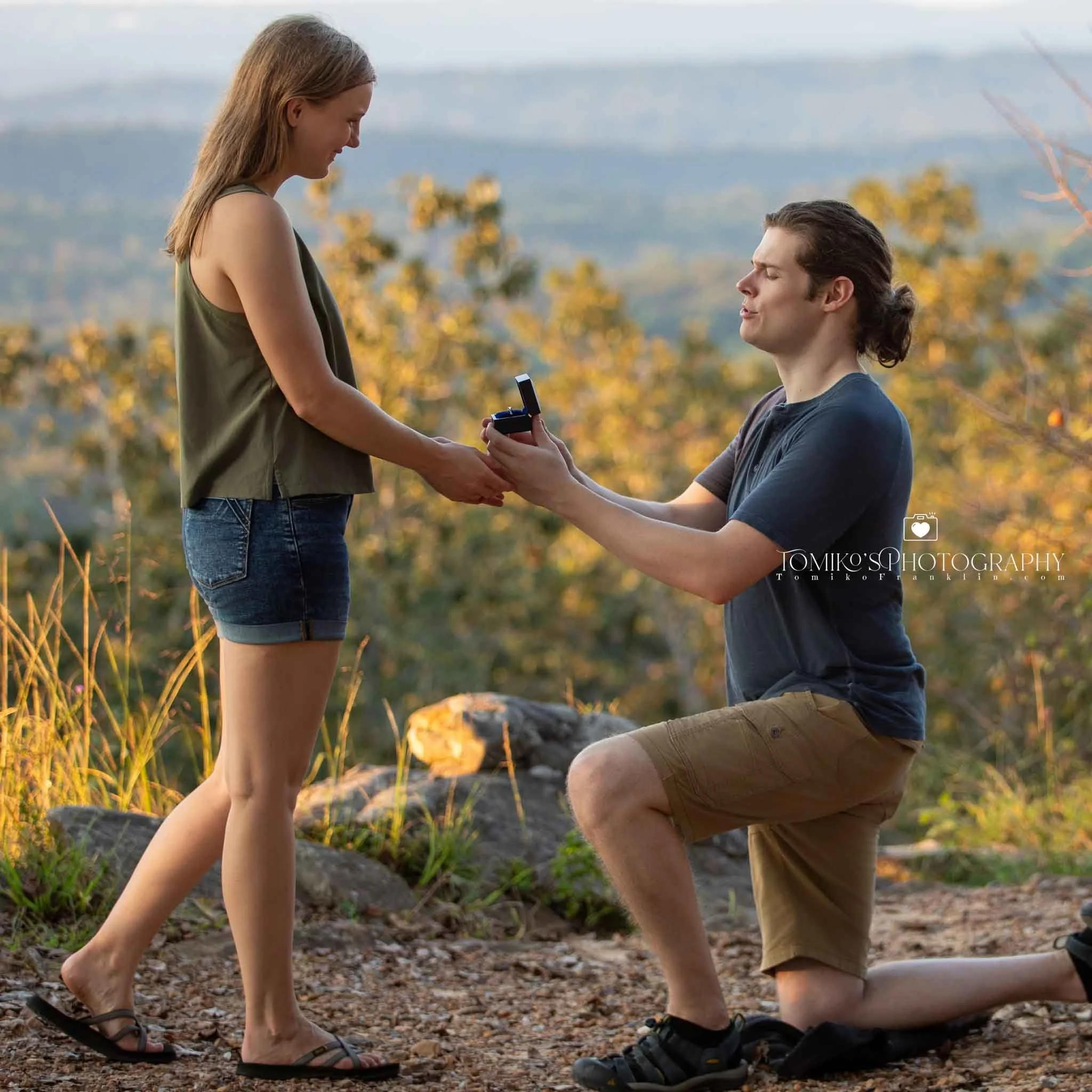 Romantic surprise proposal at Oak Mountain’s mountain overlook with luxury editorial‑style photography.