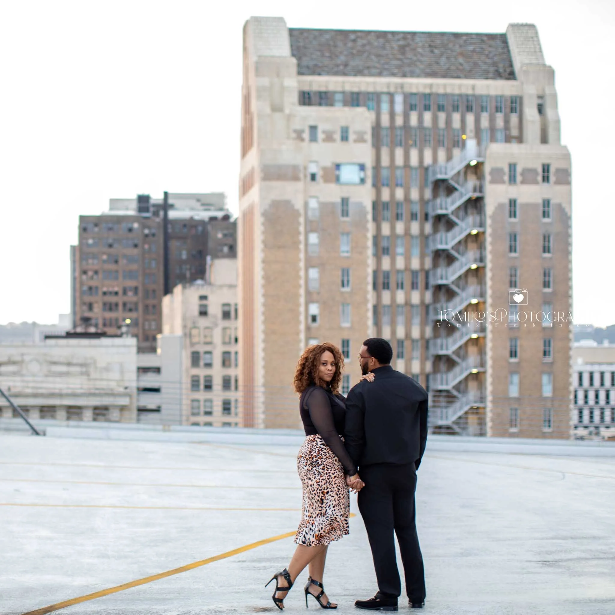 Engagement photographer capturing a couple’s joyful moment at Railroad Park with golden hour glow in Birmingham.