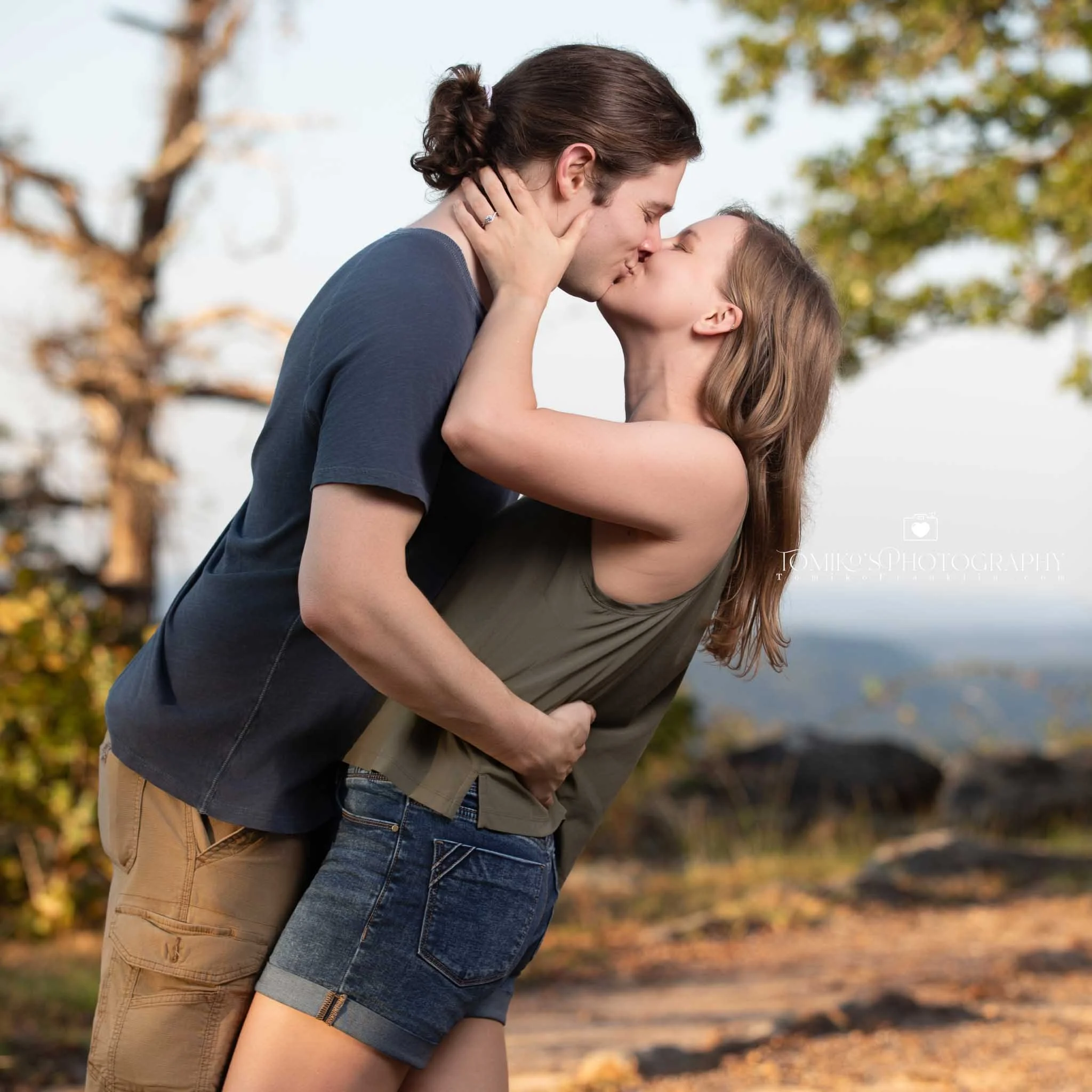 Surprise proposal with candid reaction photography at Oak Mountain’s mountain overlook near Birmingham AL.