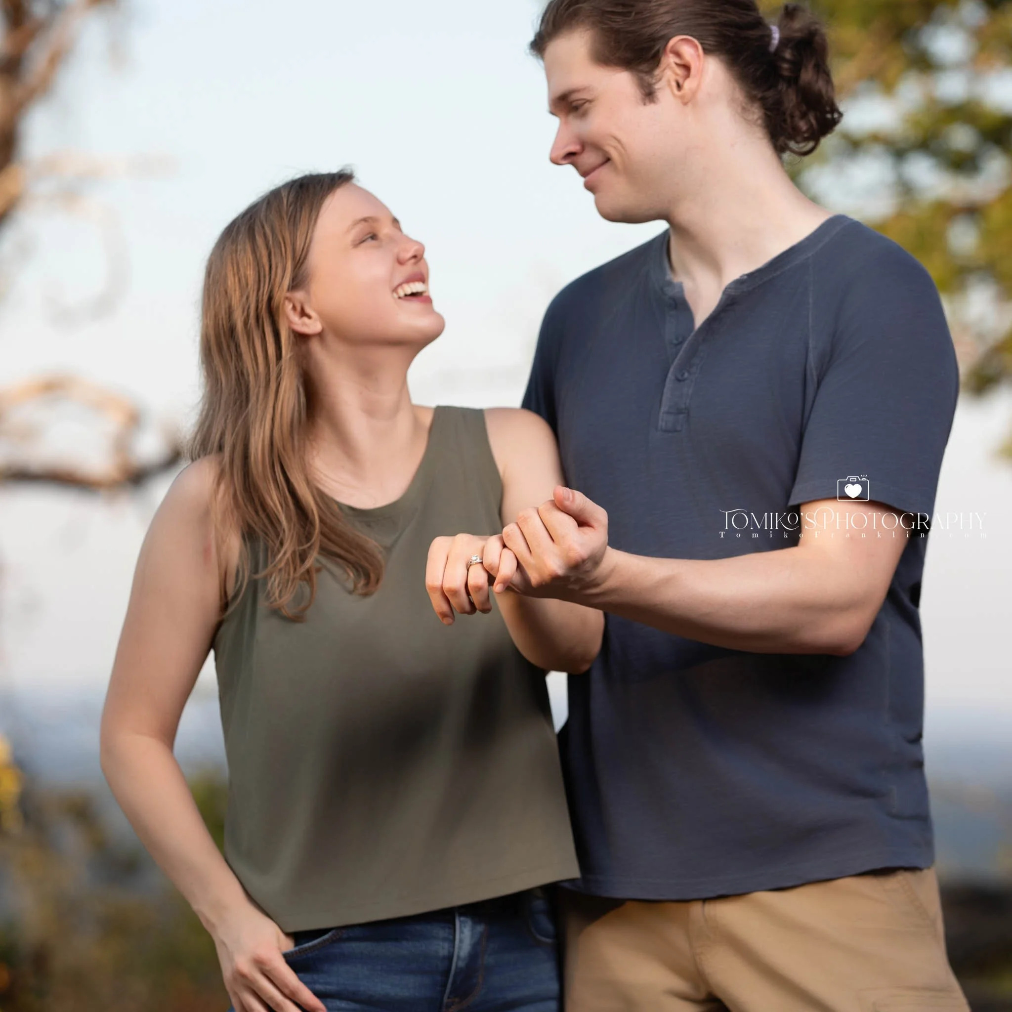 Hidden photographer capturing the exact moment he proposes at Oak Mountain State Park near Birmingham AL.