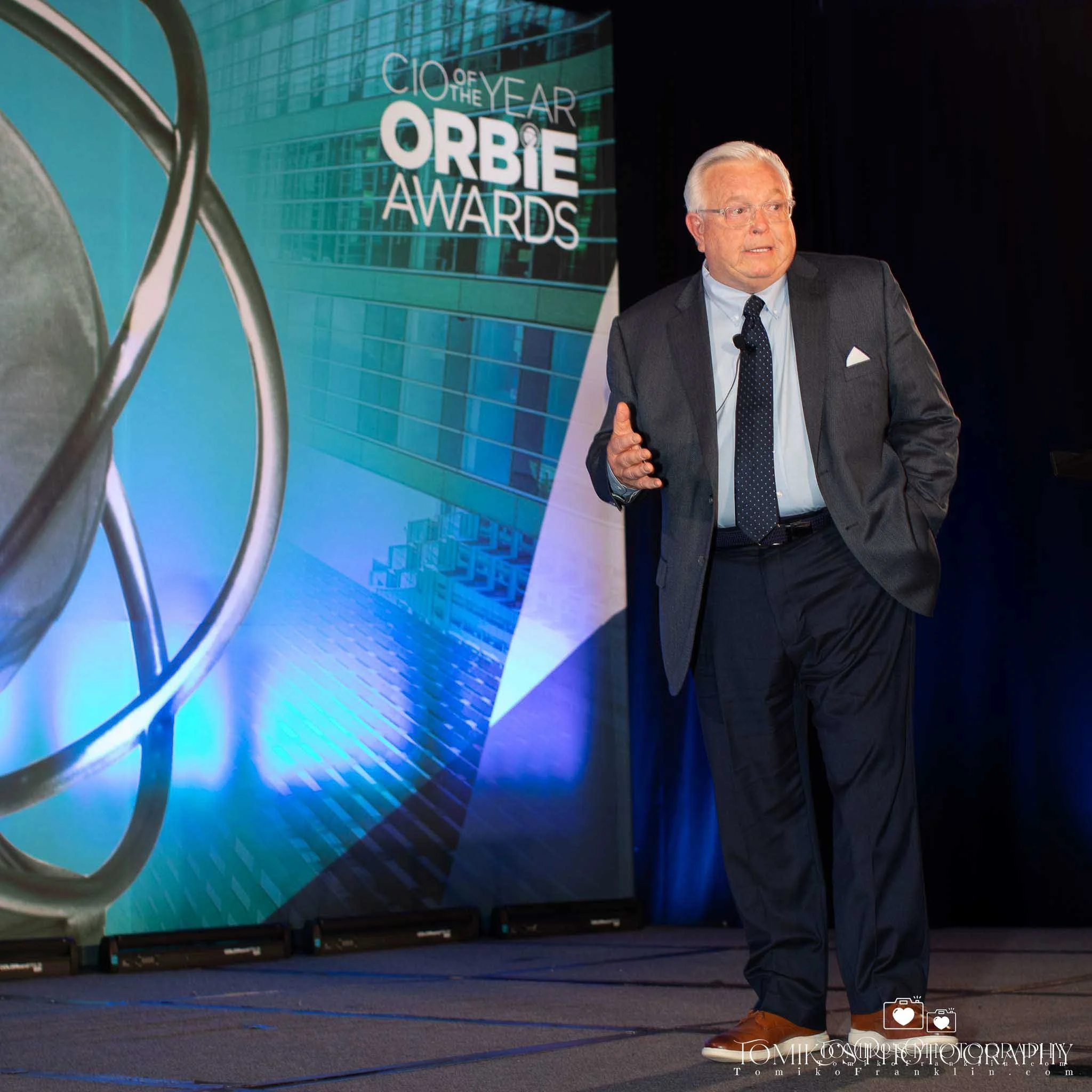 An Event-Photographer Photo of a Professional Giving a Speech at a Corporate Event