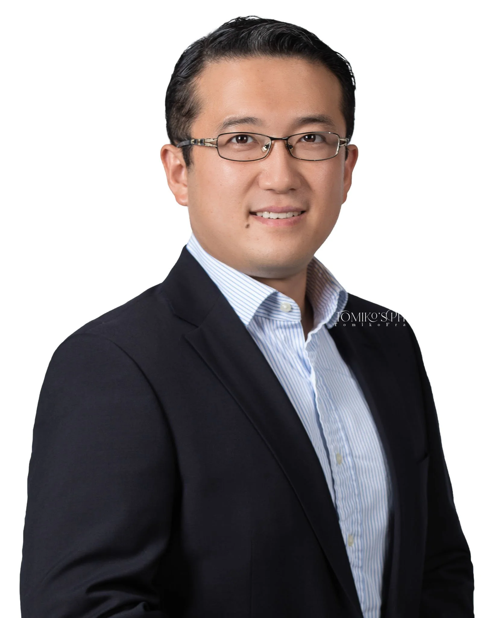 Professional headshot of man with white background