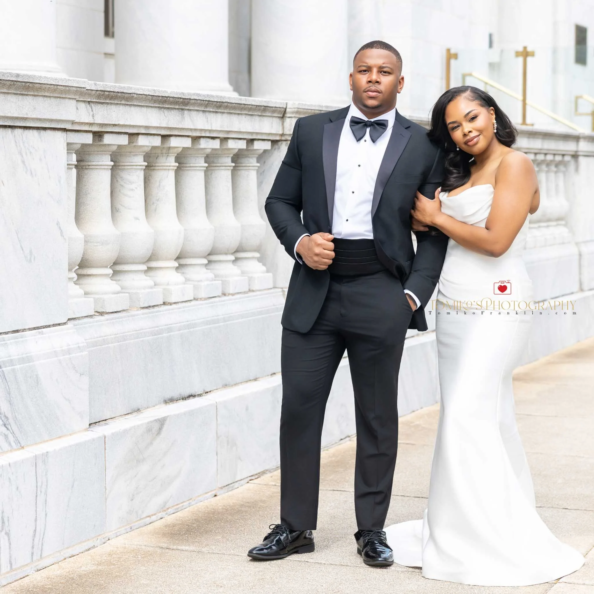 Documentary‑style elopement photo of a couple exchanging vows at the courthouse.