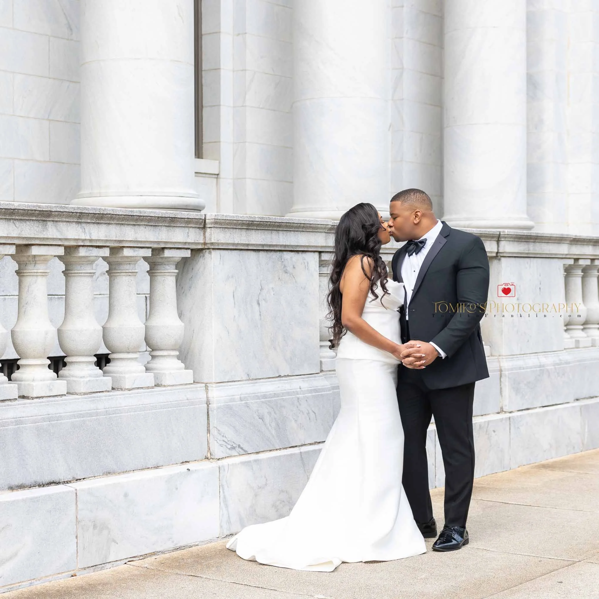 Elopement couple posing outside the Birmingham courthouse after their intimate ceremony.