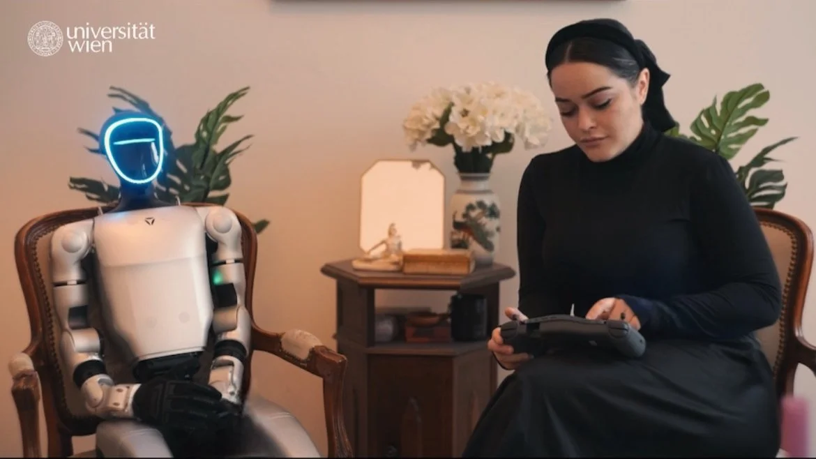 woman sitting with robot for interview