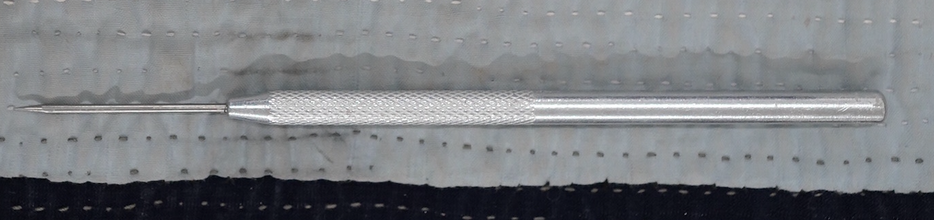 A needly tool for making and trimming pottery.