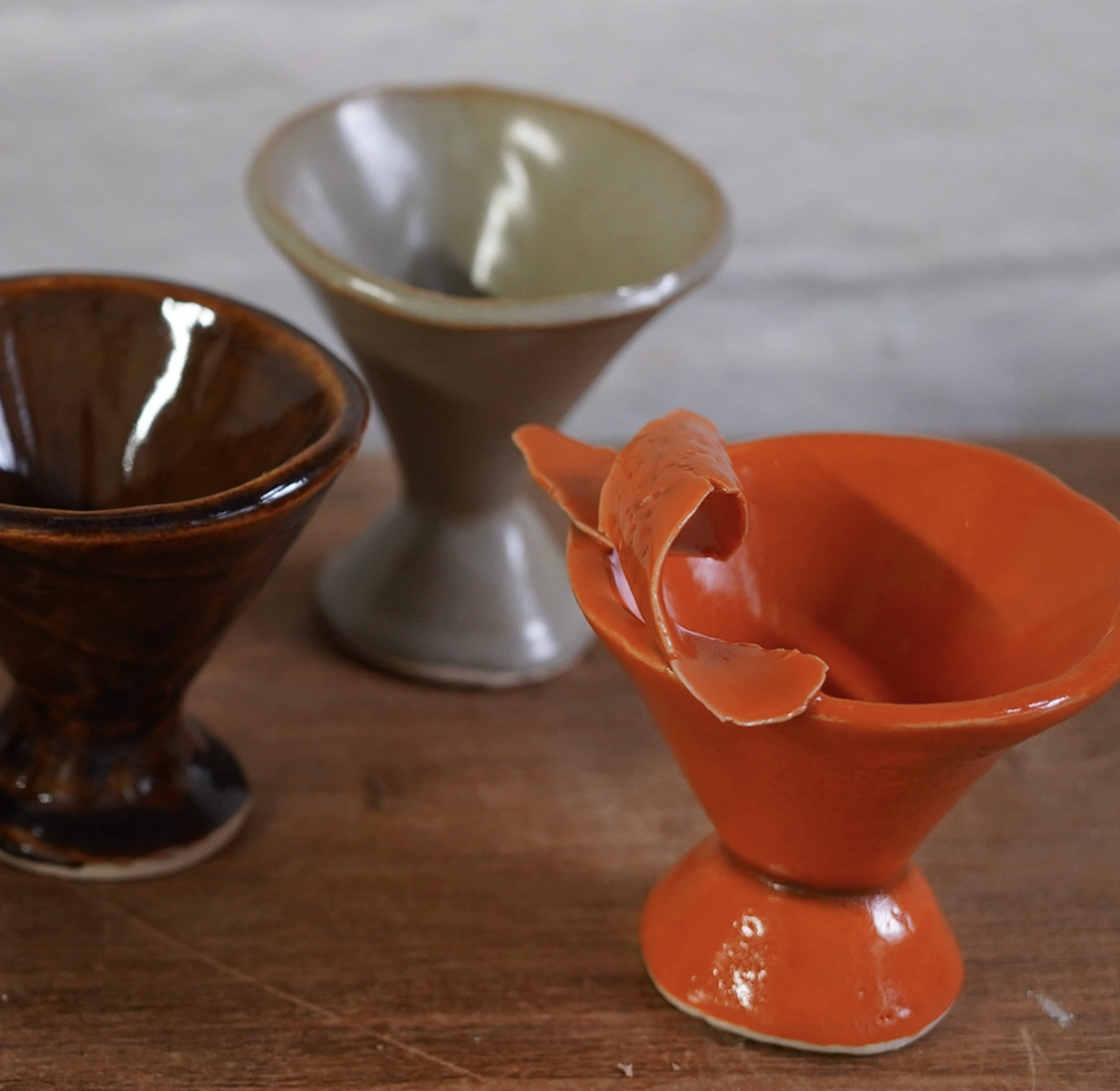 Handmade martini glasses adorn a table