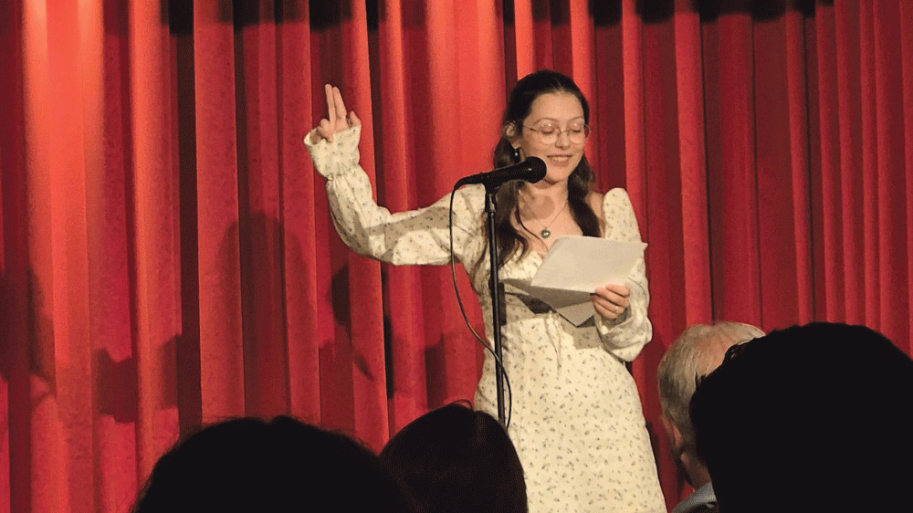 Ciara-Campbell-writer-reciting-her-poem-at-the-Open-Mic-Night-for-the-audience-as-part-of-the-Lucan-Festival.png