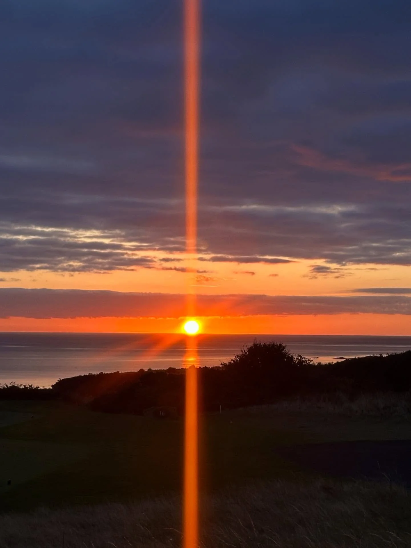 Grateful for our Rew Rew today and every day. This sunrise from St. Andrews, with a cross stretching through the sky, felt like a reminder that his light continues to rise with us from above.