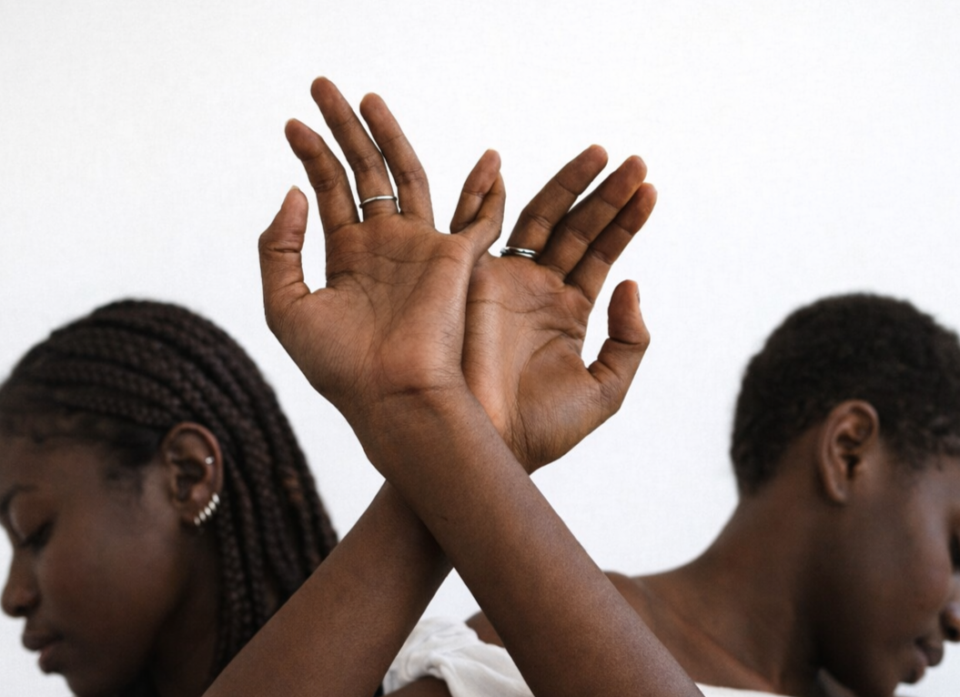 Close-up of a person's back and neck with shiny, wet skin.
