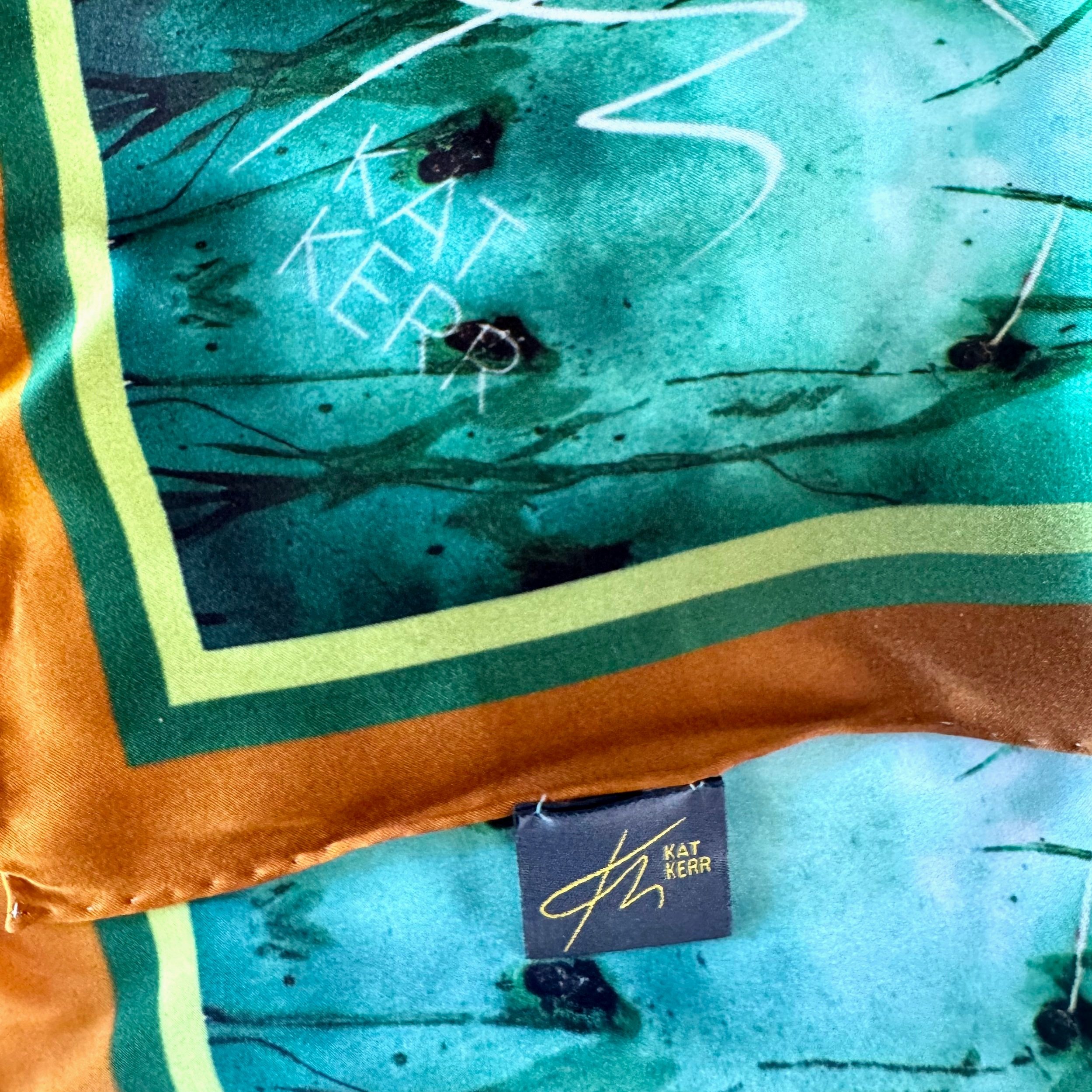 detail showing edge corner of "quenched" silk scarf - texure, double sided printing, edging, logo and label