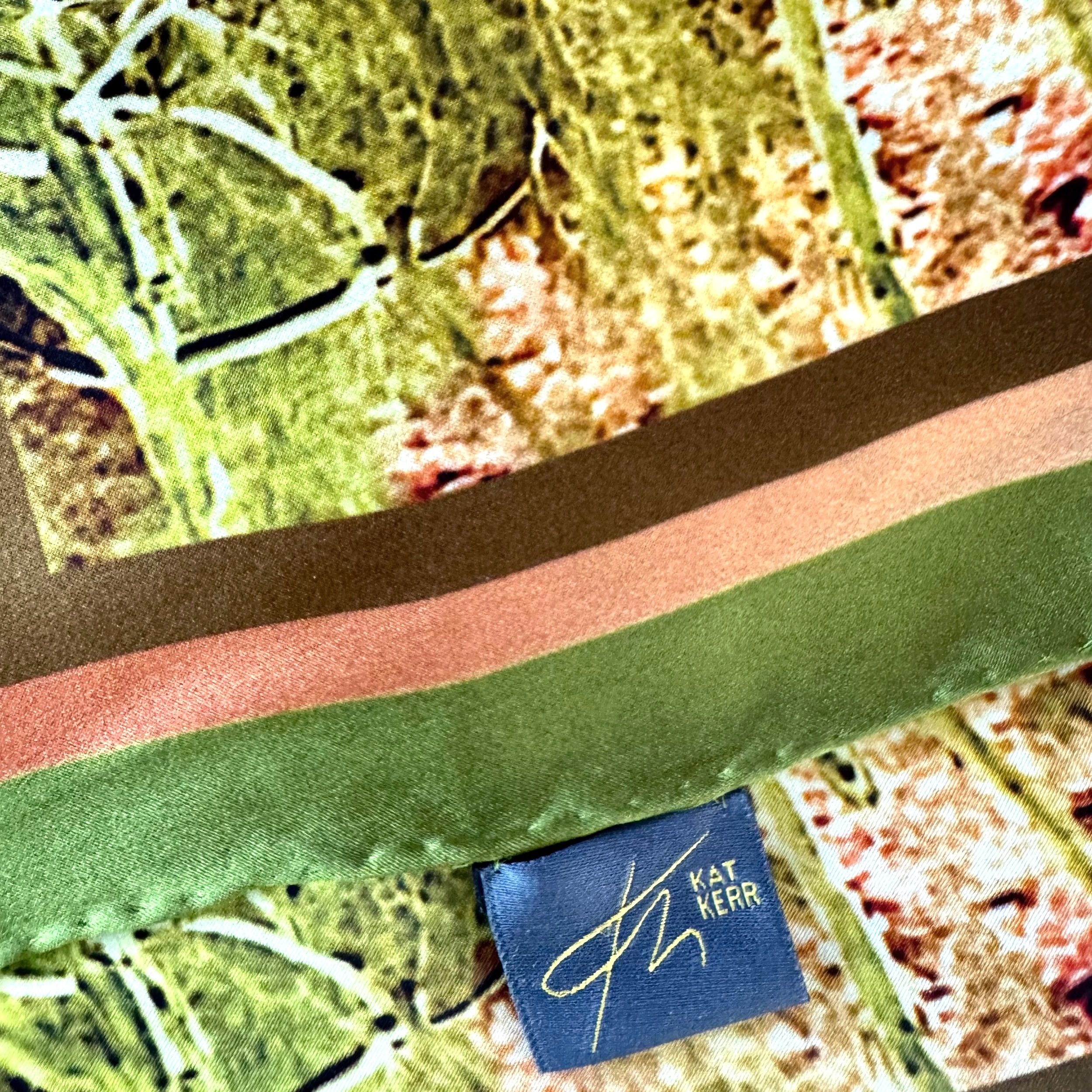 Edge detail of "Their Roots Grow Deep" showing logo and label, hand sewn edging, textures and double sided printing