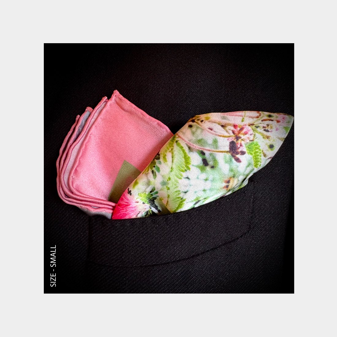 Sweet Succulents silk scarf is shown as a Pocket Square adding pink patterns cascading from the breast pocket of a black wool suit jacket
