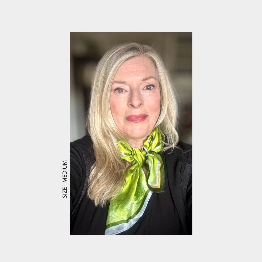 A portrait of KAT KERR wearing "Diversion" silk scarf, size medium.