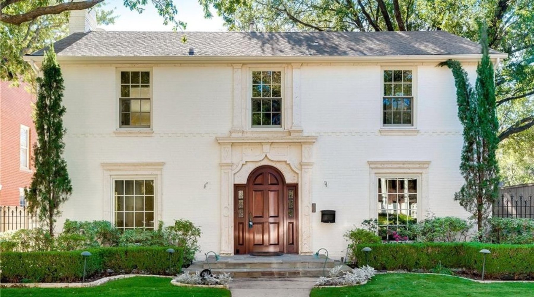 Front exterior of an elegant home sold by Lily Moore in Highland Park, Texas, in the Park Cities
