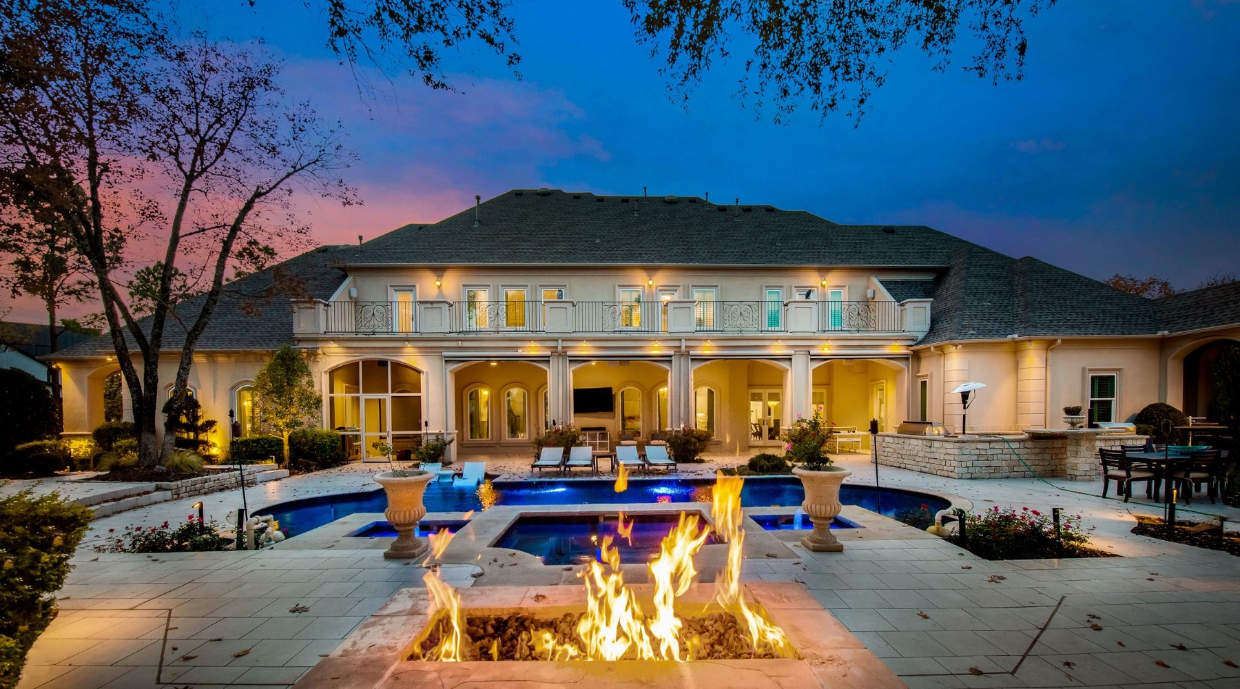 Twilight pool and outdoor living area at a luxury home sold by Lily Moore in Keller, Texas