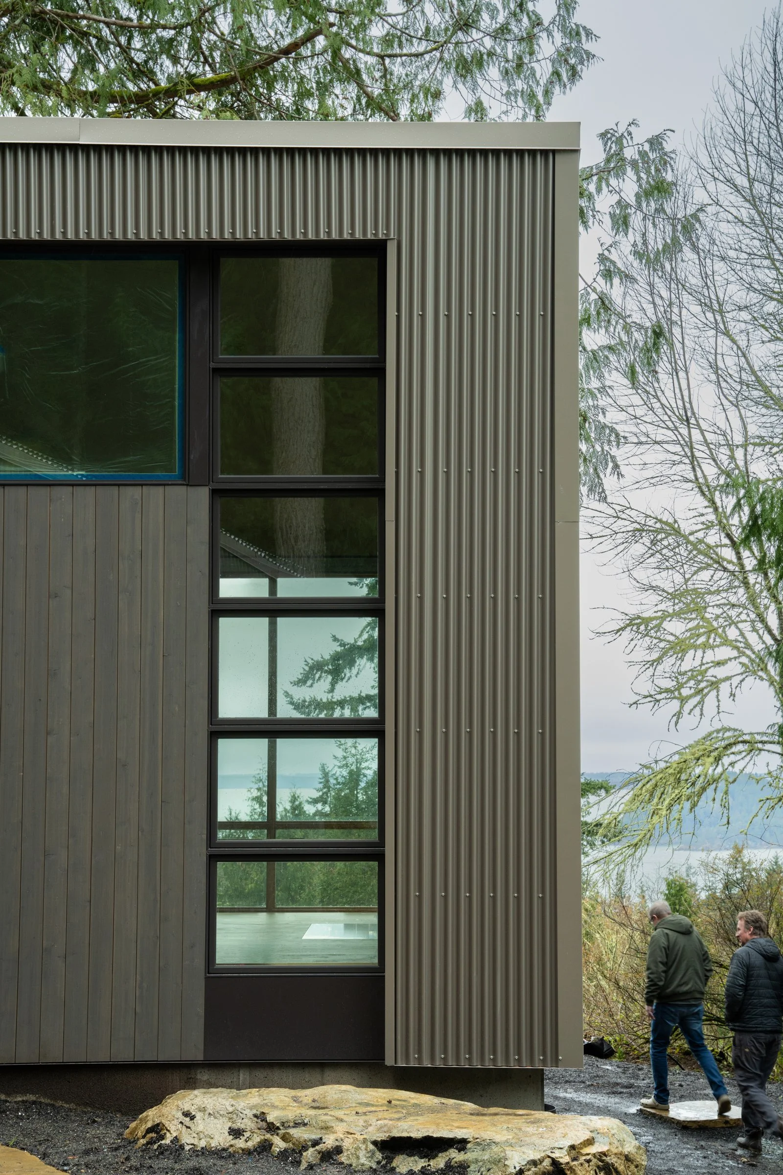 The main level maximizes coastal views with the garage and basement embedded into the hillside of the sandstone-rich Chuckanut Formation. The project’s primary goal was to create a structure that integrates seamlessly with its natural surroundings wh