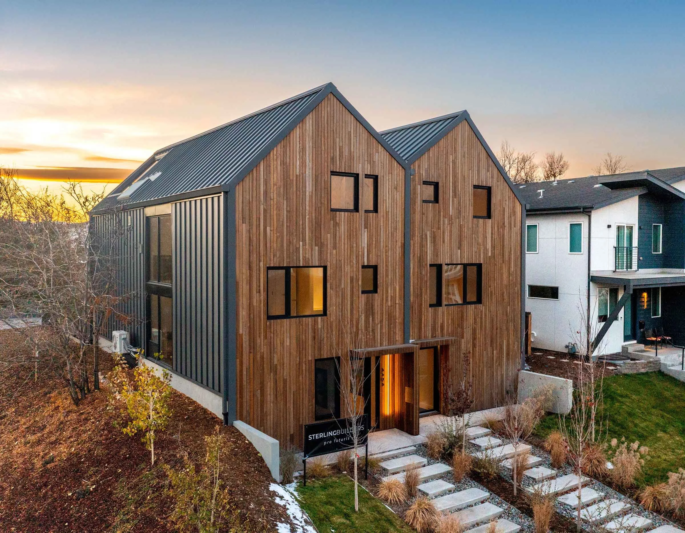 Front view of Englewood Passive House Duplex at sunset, structurally engineered by Plan North Engineers