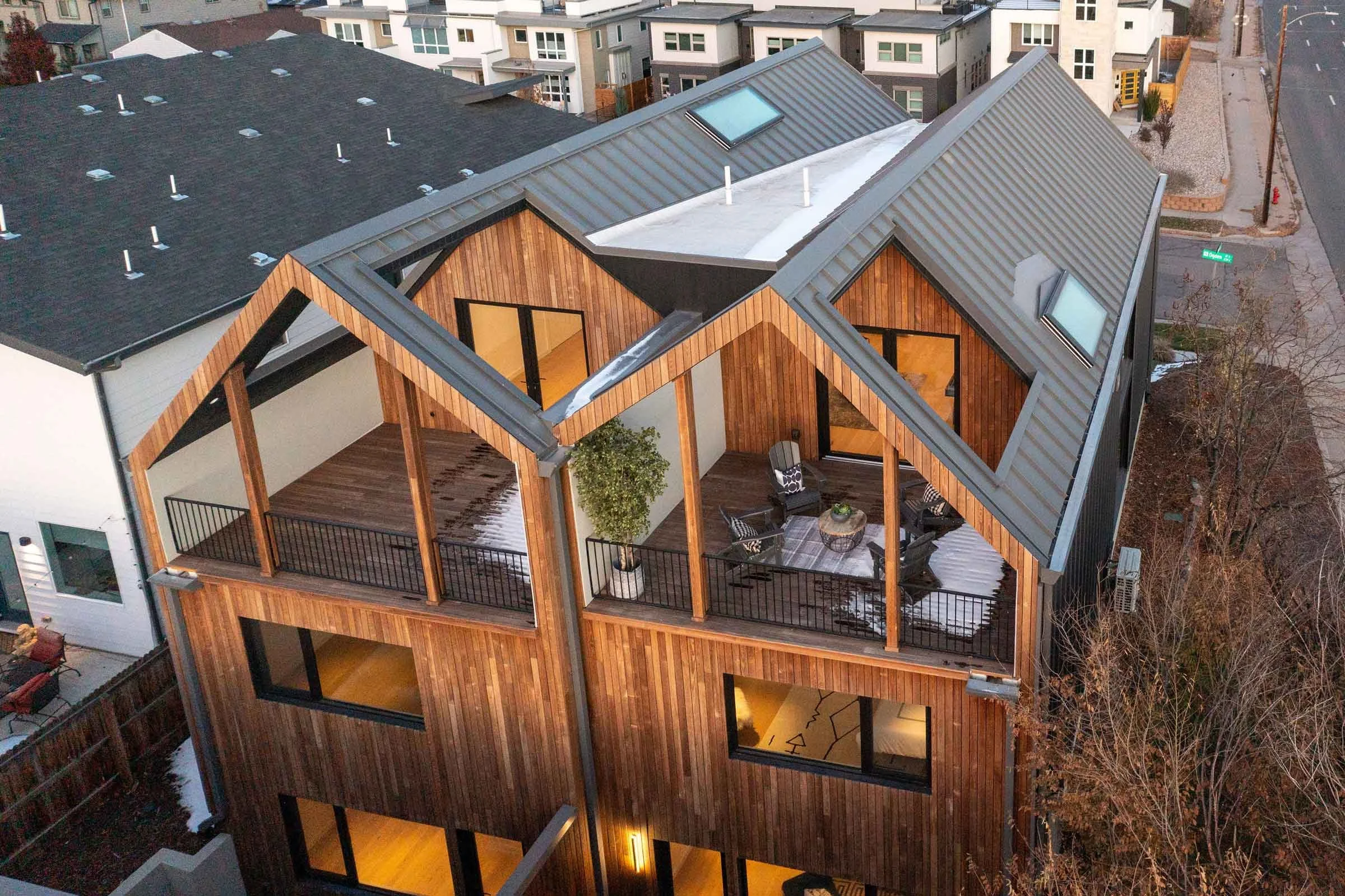 Aerial view of award-winning Passive House duplex with rooftop decks engineered by Plan North Engineers