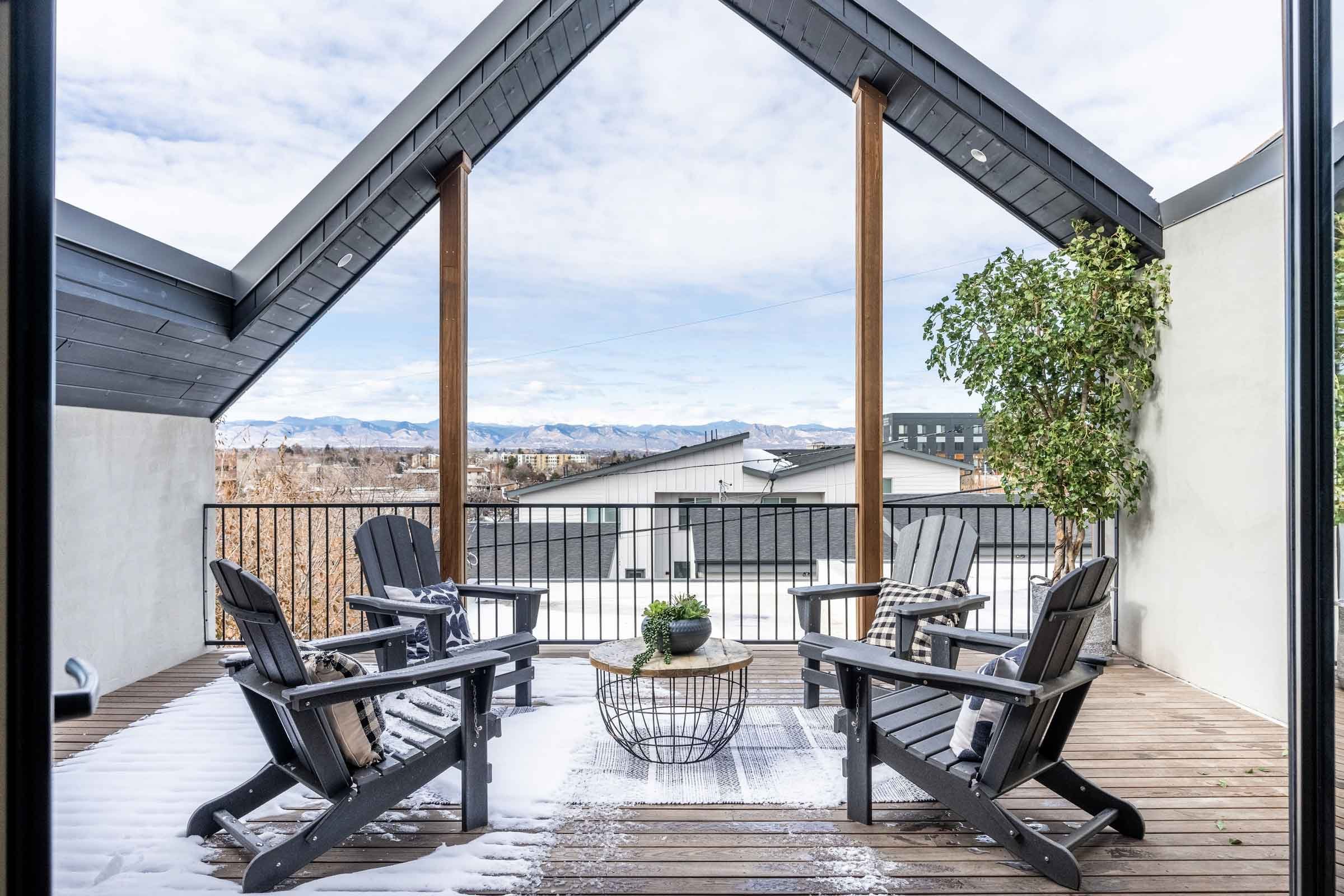 Snow-covered rooftop deck on award-winning Passive House duplex engineered by Plan North Engineers in Colorado.