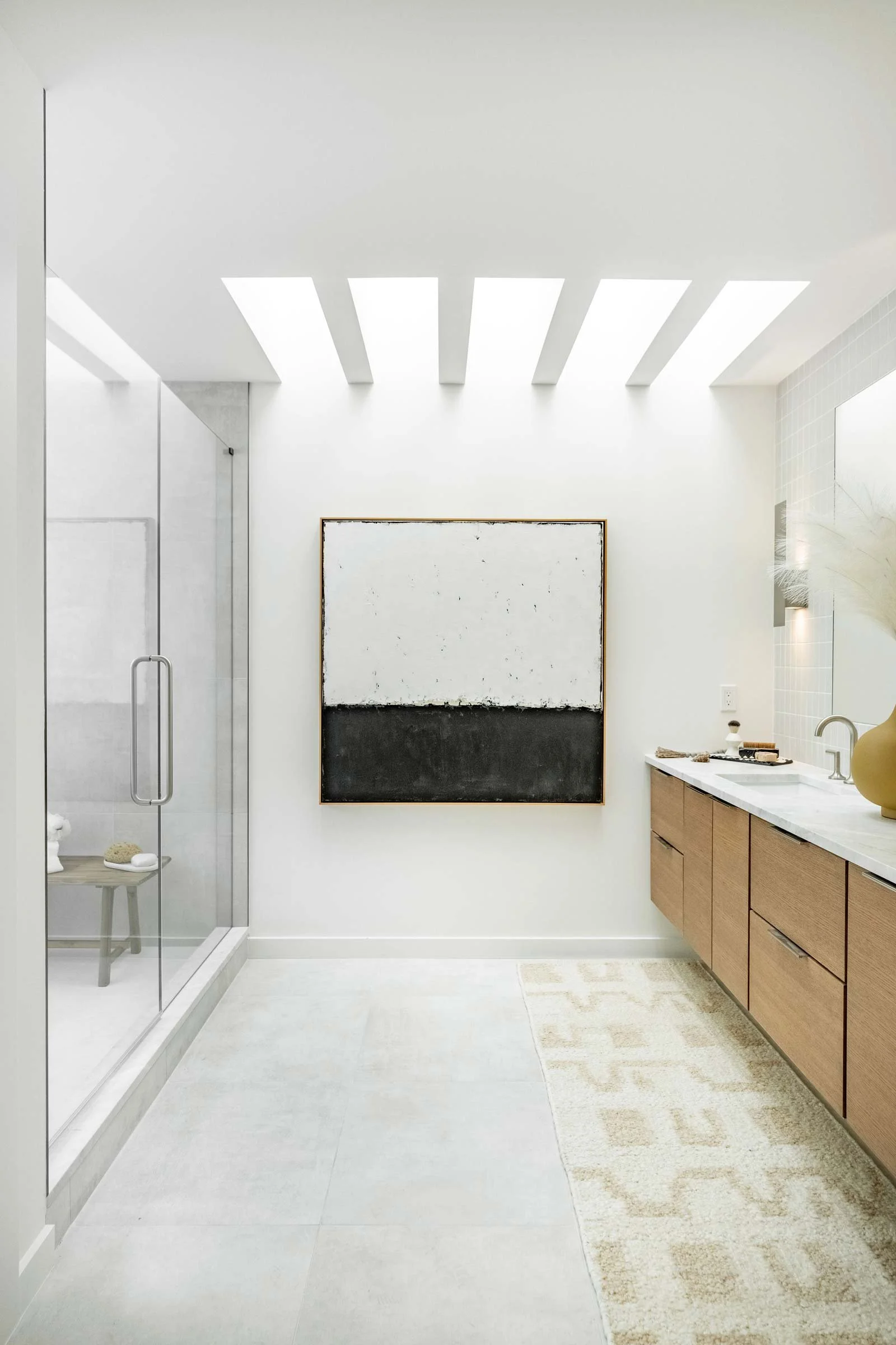 Modern Passive House bathroom with skylight and energy-efficient structural detailing by Plan North Engineers