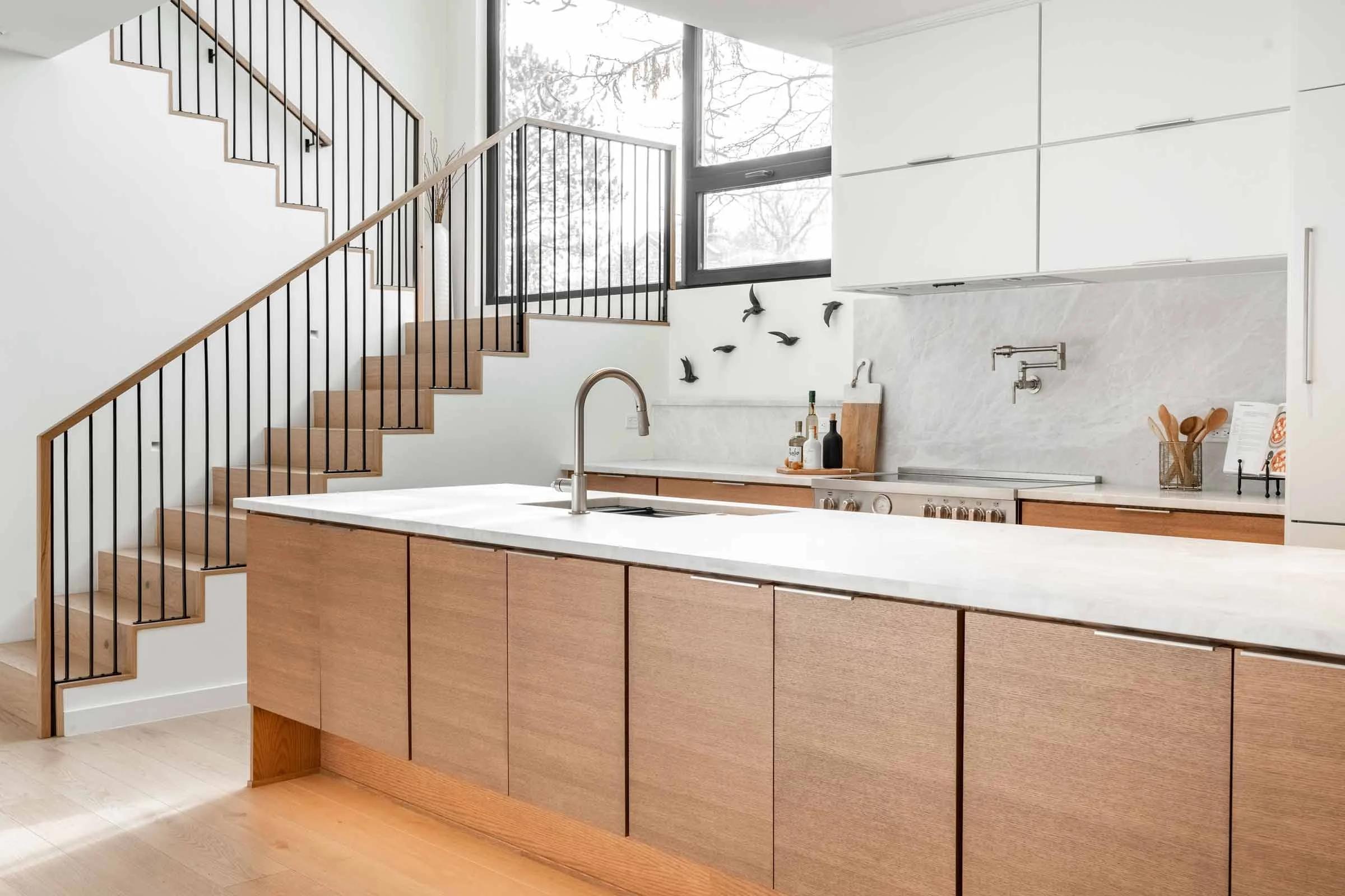 Modern Passive House kitchen and staircase with integrated structural design by Plan North Engineers in Englewood, Colorado