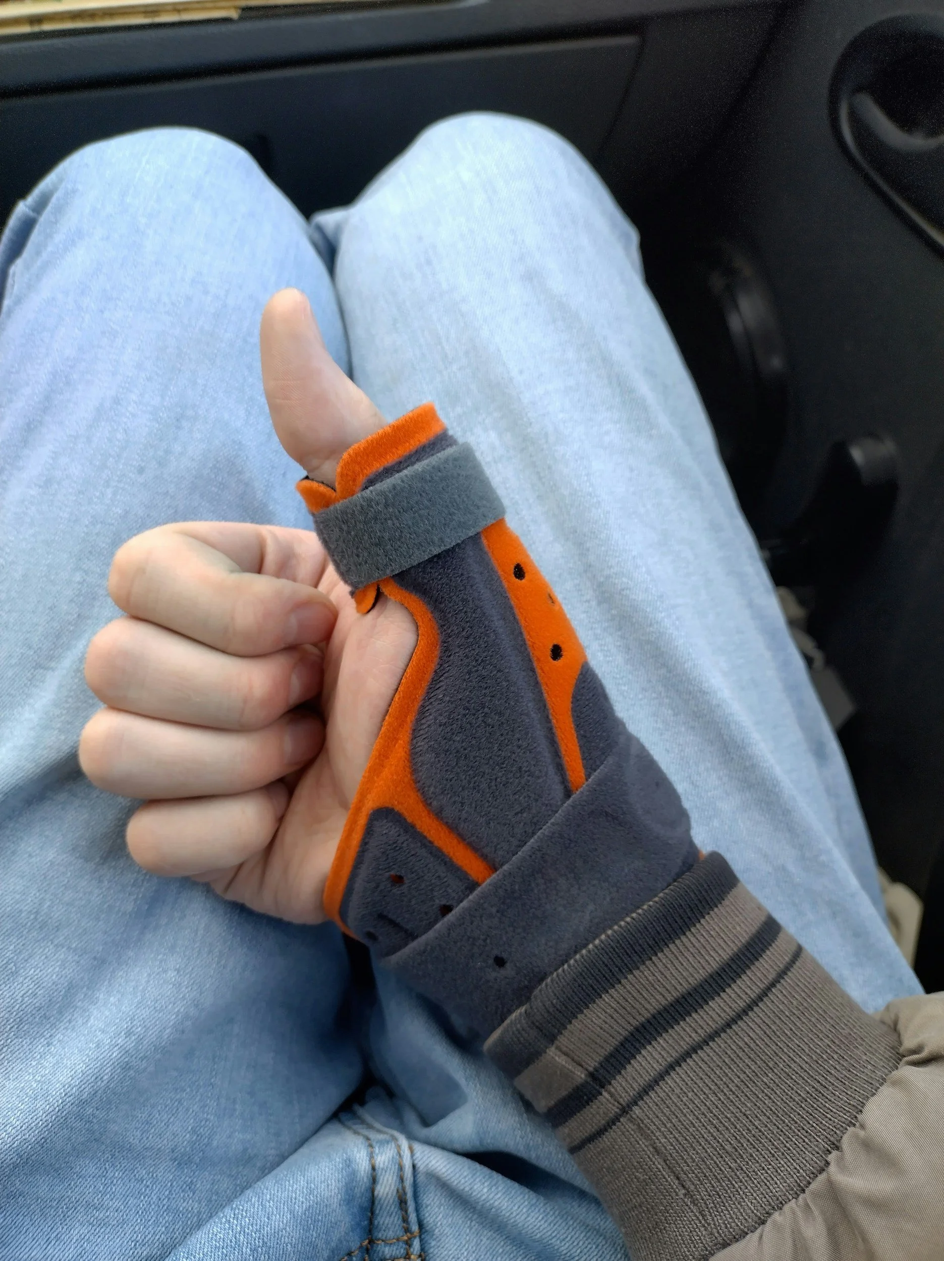 an injured hand with a wrist brace on