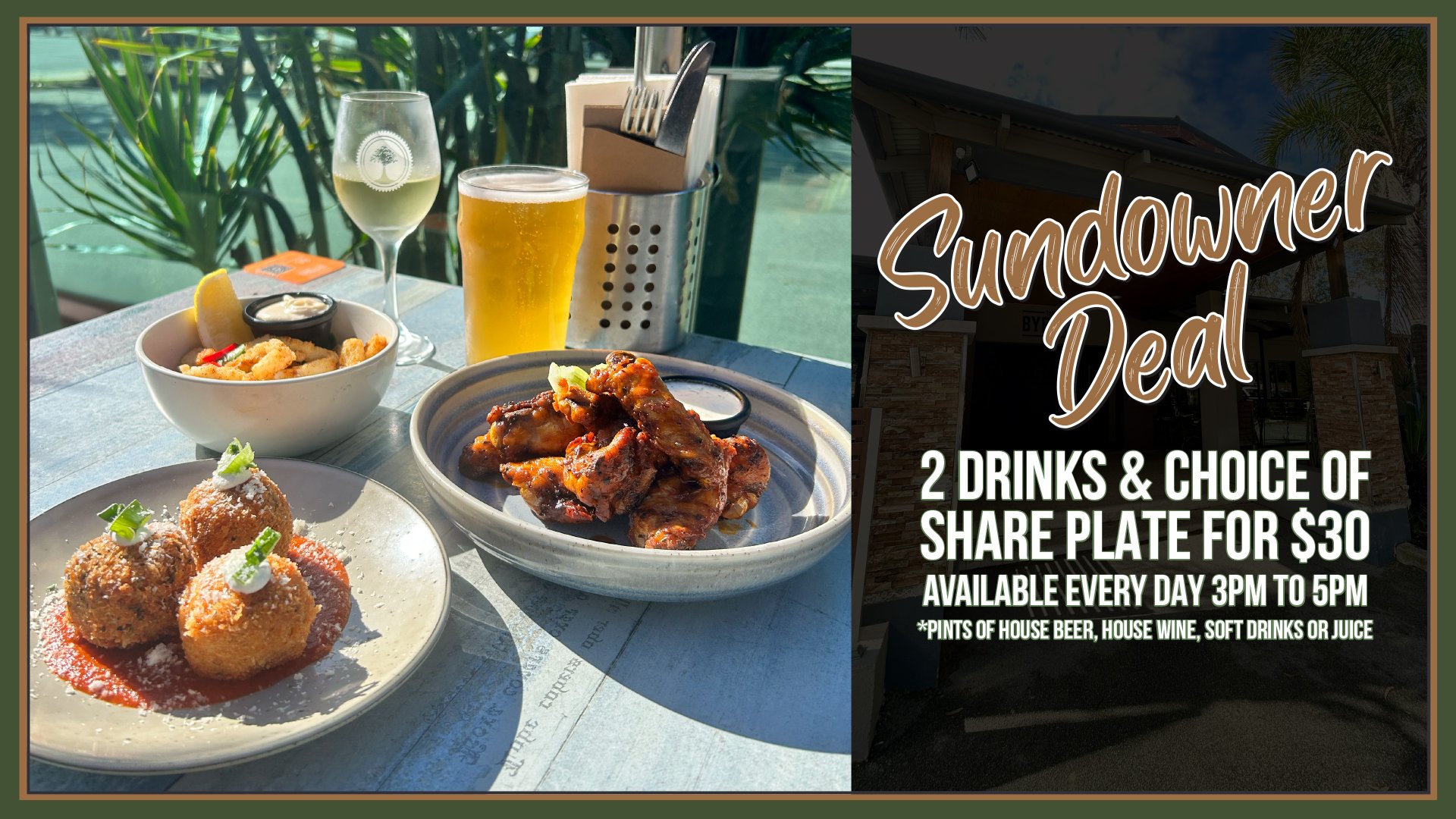 Table with a bowl of fried calamari, a plate of Italian meatballs with tomato sauce and grated cheese, a glass of white wine, a glass of beer, and a napkin holder, set outdoors with green plants in the background.