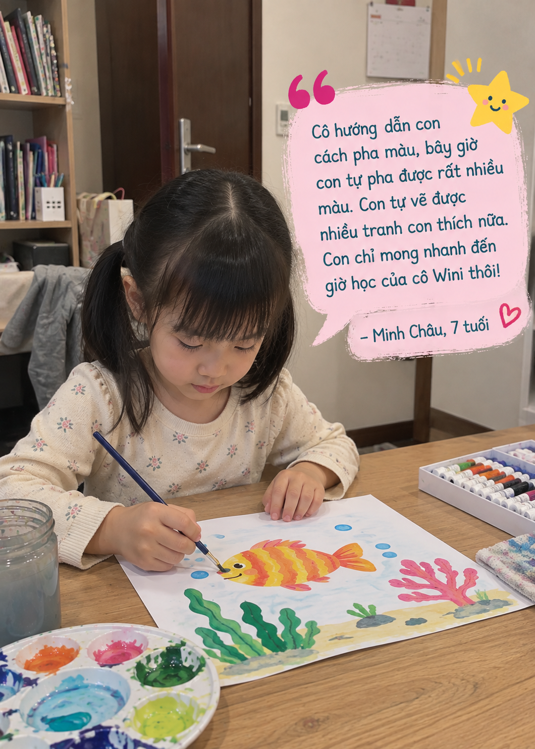 A young girl is painting an underwater scene, featuring a colorful fish with orange and yellow stripes, seaweed, and coral, using watercolor paints.