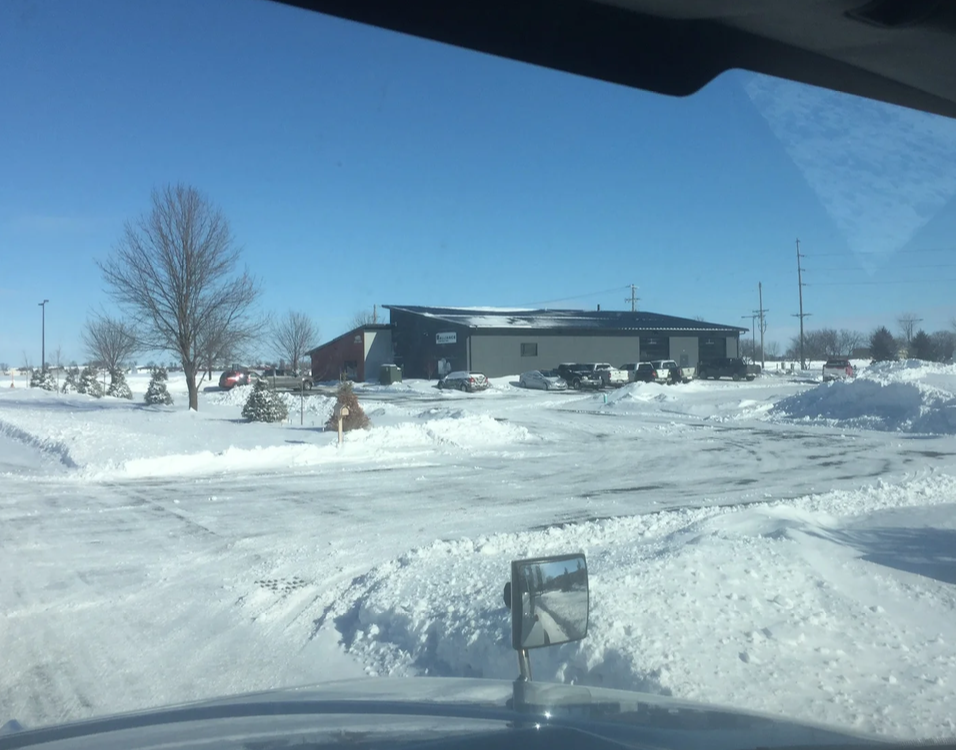 Rock salt application on a large parking lot