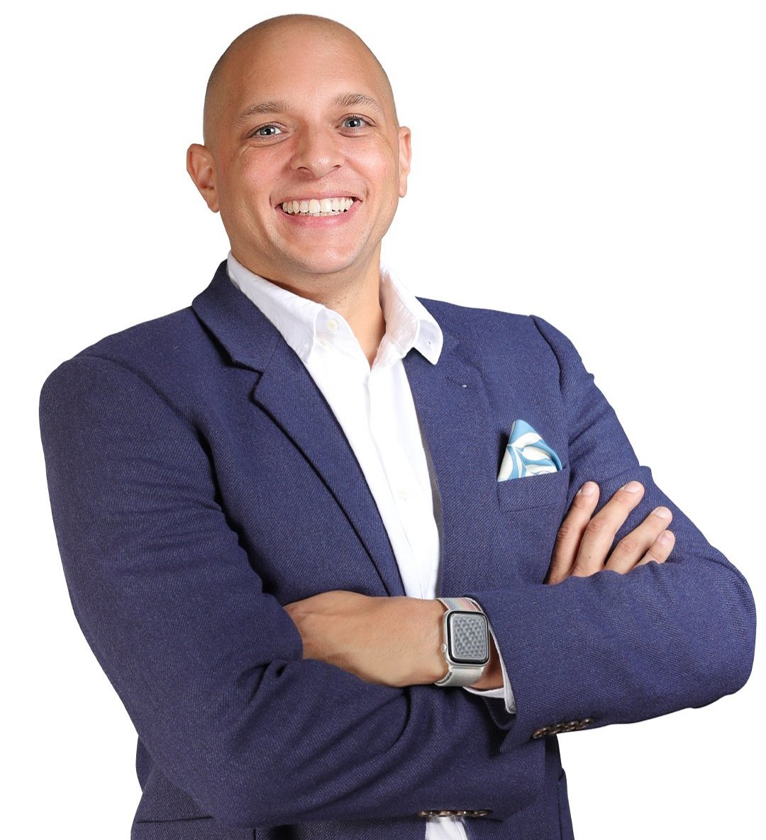 bald man in business jacket posting with arms crossed