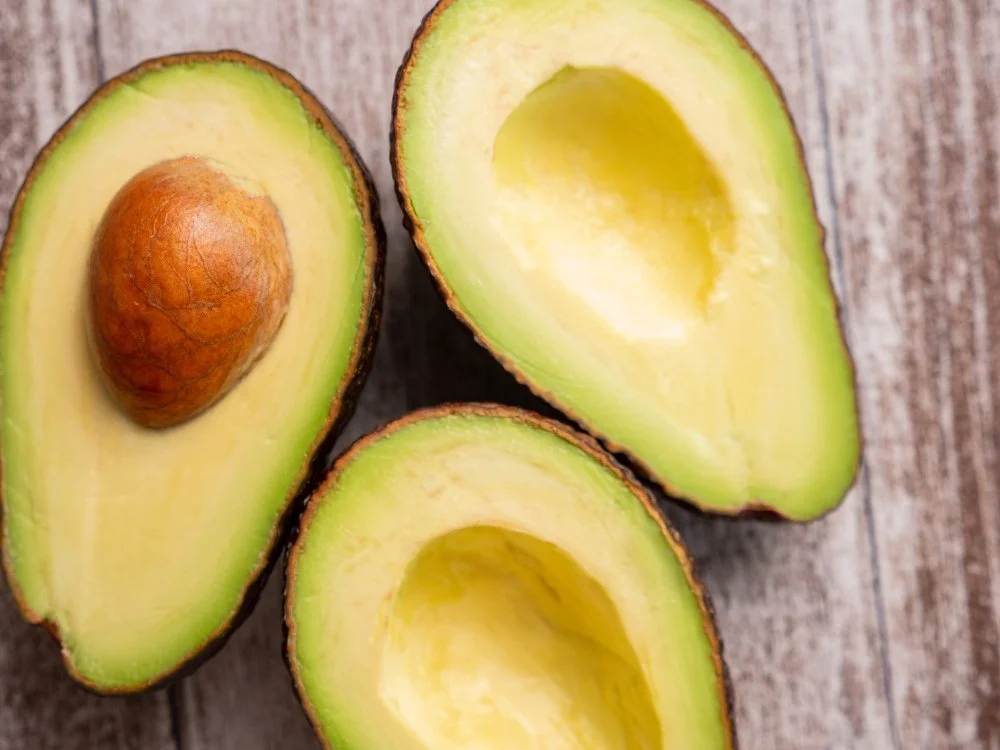 top-view-fresh-cutted-avocado-wooden-board.jpeg