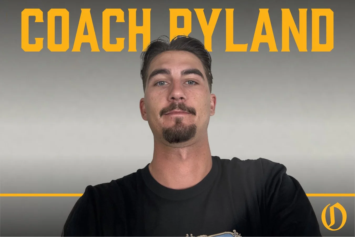 A man with dark hair, a goatee, and a mustache, wearing a black T-shirt, looking at the camera with a neutral expression. Behind him is a gray background with yellow text that reads 'Coach Ryland' at the top, and a small yellow logo in the bottom right corner.