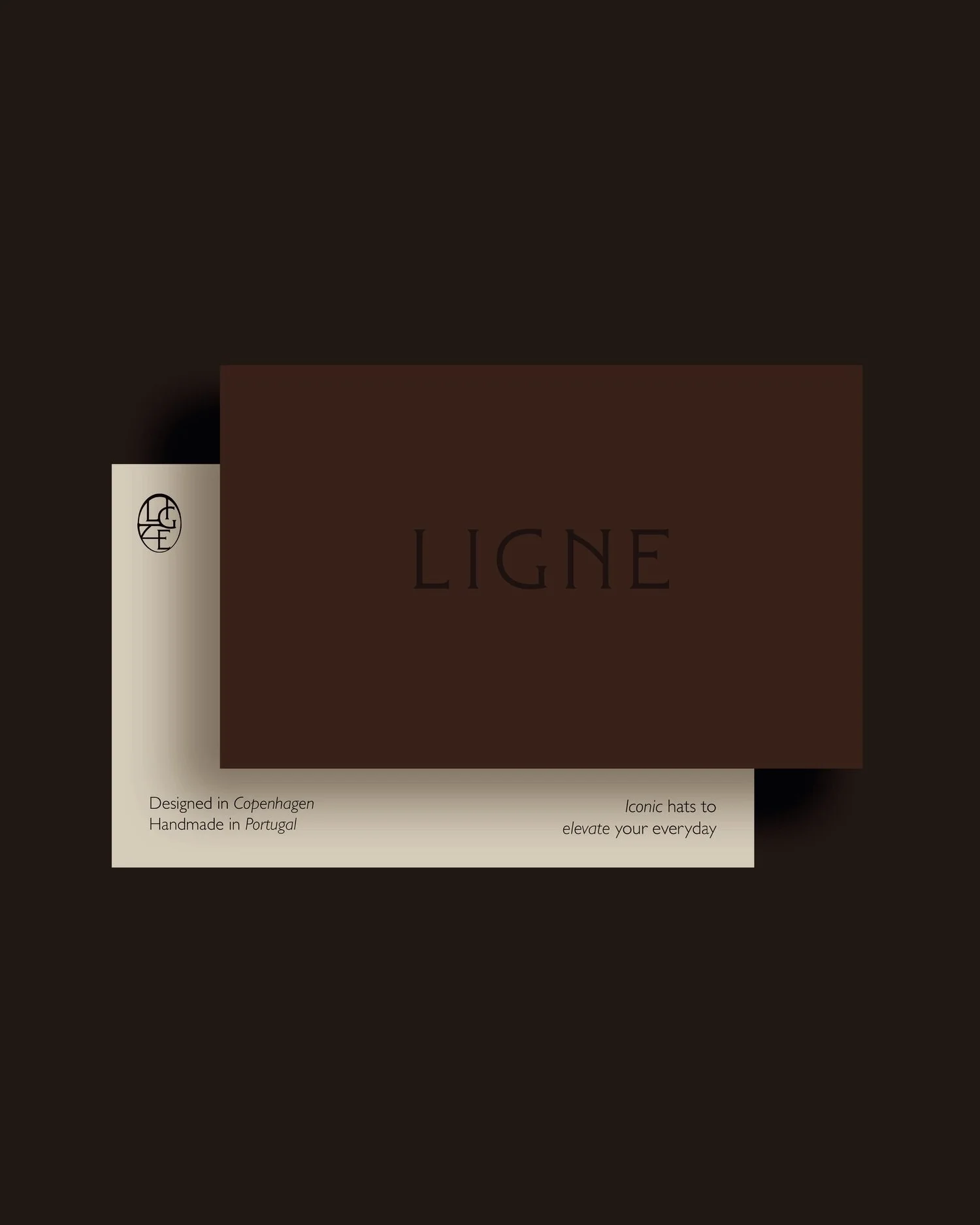 A dark background with a beige text box that contains the word 'LIGNE' in large, bold letters. The text box also has smaller text indicating that the product is designed in Copenhagen, handmade in Portugal, and that it features iconic hats to elevate your everyday style.