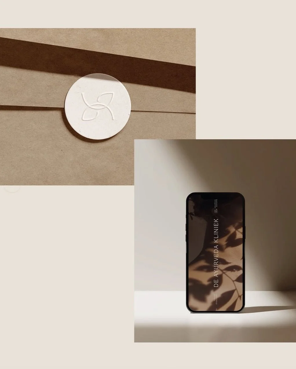 A smartphone displaying the text 'DE AYURVEDA KLINIEK' on its screen, placed on a flat surface with shadows of leaves cast over it, beside a white circular object with an embossed logo, on a neutral background.