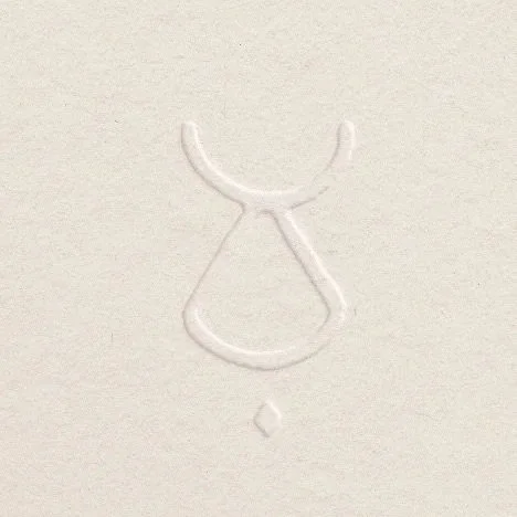 White textured surface with a simple line drawing of a dress or skirt.