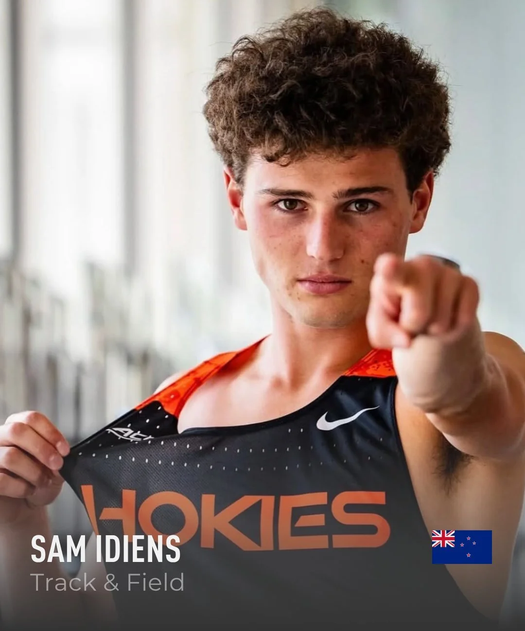 Australian track and field athlete in a Virginia Tech Hokies jersey pointing at the camera, with an Australian flag in the corner.