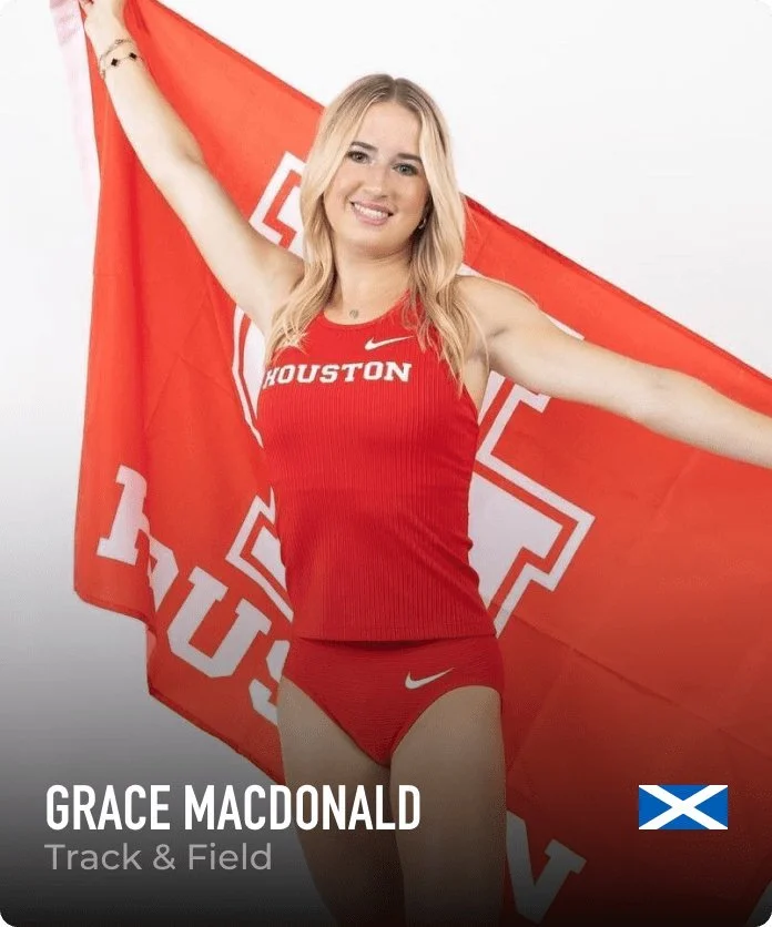 Athletic woman in red sports uniform holding a large red flag with a white cross and the word 'Houston' on it, smiling at camera. The name 'Grace MacDonald' and the sport 'Track & Field' are displayed, along with a small Scottish flag.