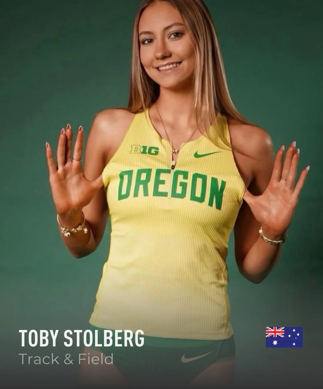 A young woman in a yellow Oregon track and field uniform making a fun gesture with her hands in front of a green background.