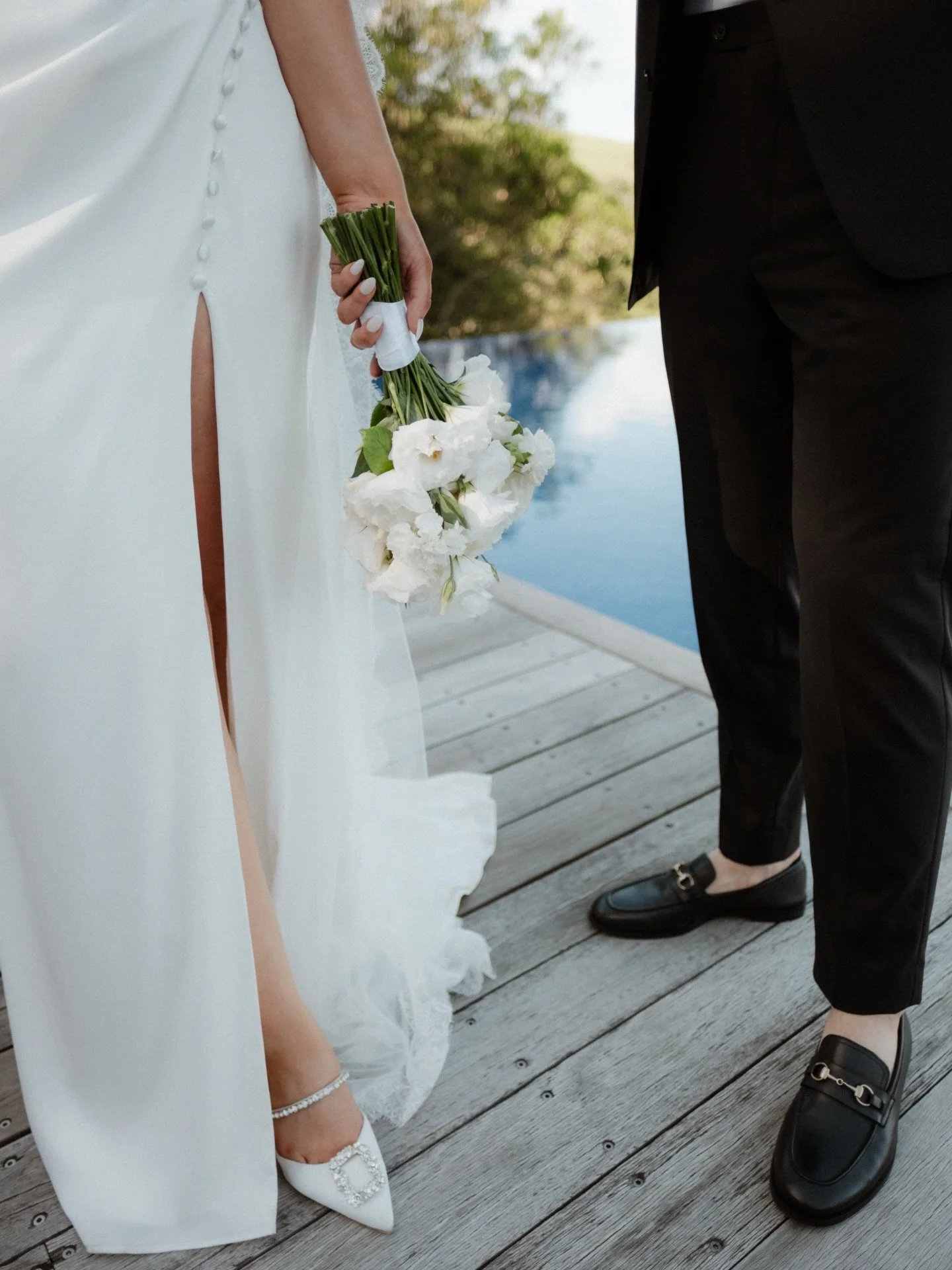All in the details for our beautiful bride 🤍
 @rubiegarling 

Photo @sarahvantreel 
Venue @oceanfarm 
Content @amorstudiobowral 
Celebrant @yourdaybykerrin 
Florals @lucygrowsflowers 

#custombridal #bridalreimagined #drapedsatin #coveredbuttons #mo